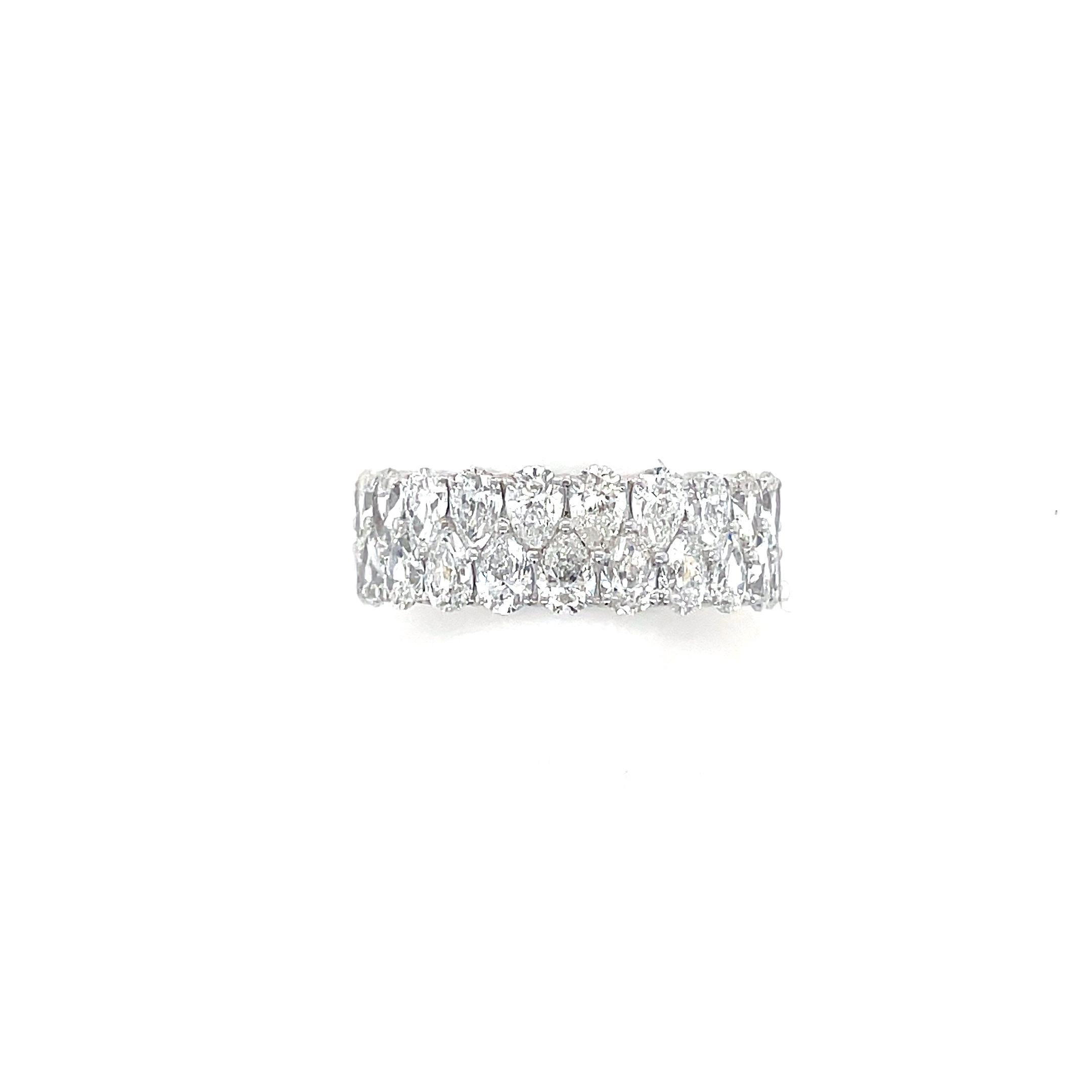 This unique eternity band contains 44 pear shaped diamonds weighing 9.00 carats total. Mounted in 18 karat white gold, this ring is beautifully crafted.

Ring size: 9
Material: 18 karat white gold
Gross weight: 11.10 grams

Diamond Characteristics