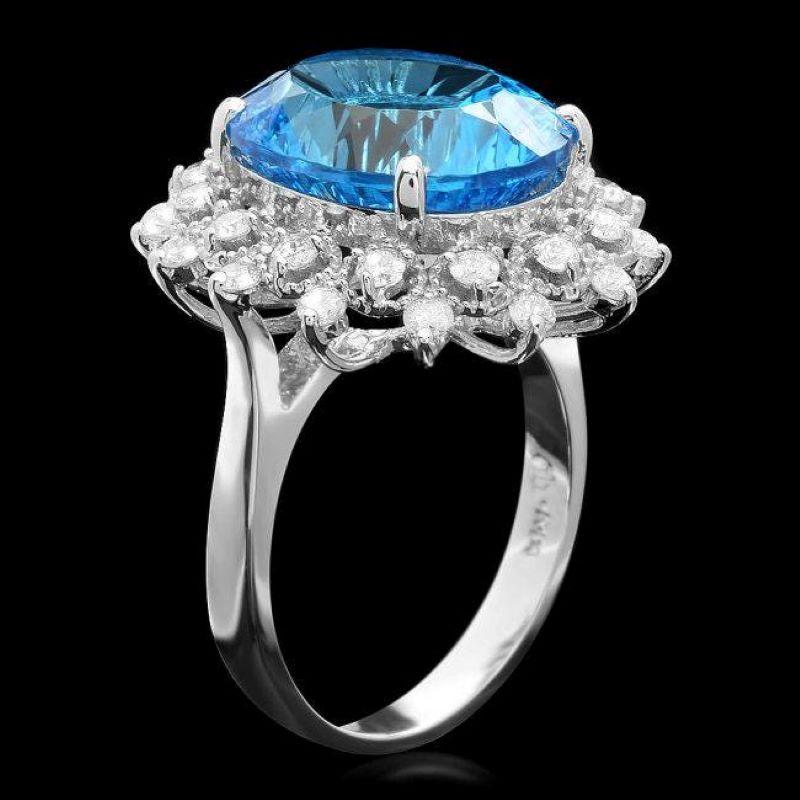 9.00 Carats Natural  Impressive Blue Topaz and Diamond 14K Solid White Gold Ring

Total Natural Blue Topaz Weight is: Approx. 8.30 Carats 

Blue Topaz Measures: Approx. 14.00 x 12.00mm

Natural Round Diamonds Weight: Approx. 0.70 Carats (color G-H /