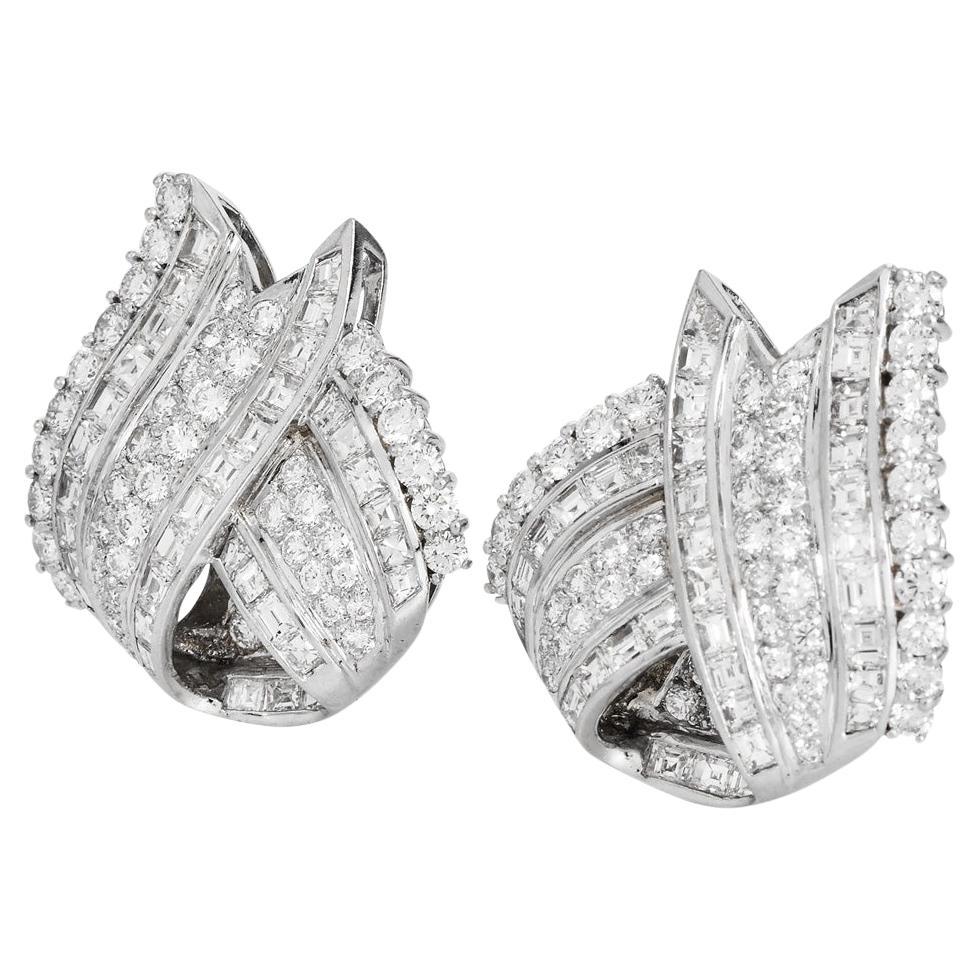Beautiful 1970s estate diamond earrings. Each piece is crafted with precision and elegance, showcasing 9.00 carats of the finest natural diamonds.

The earrings are artfully constructed with both channel and pavé-set stones, featuring 100 round