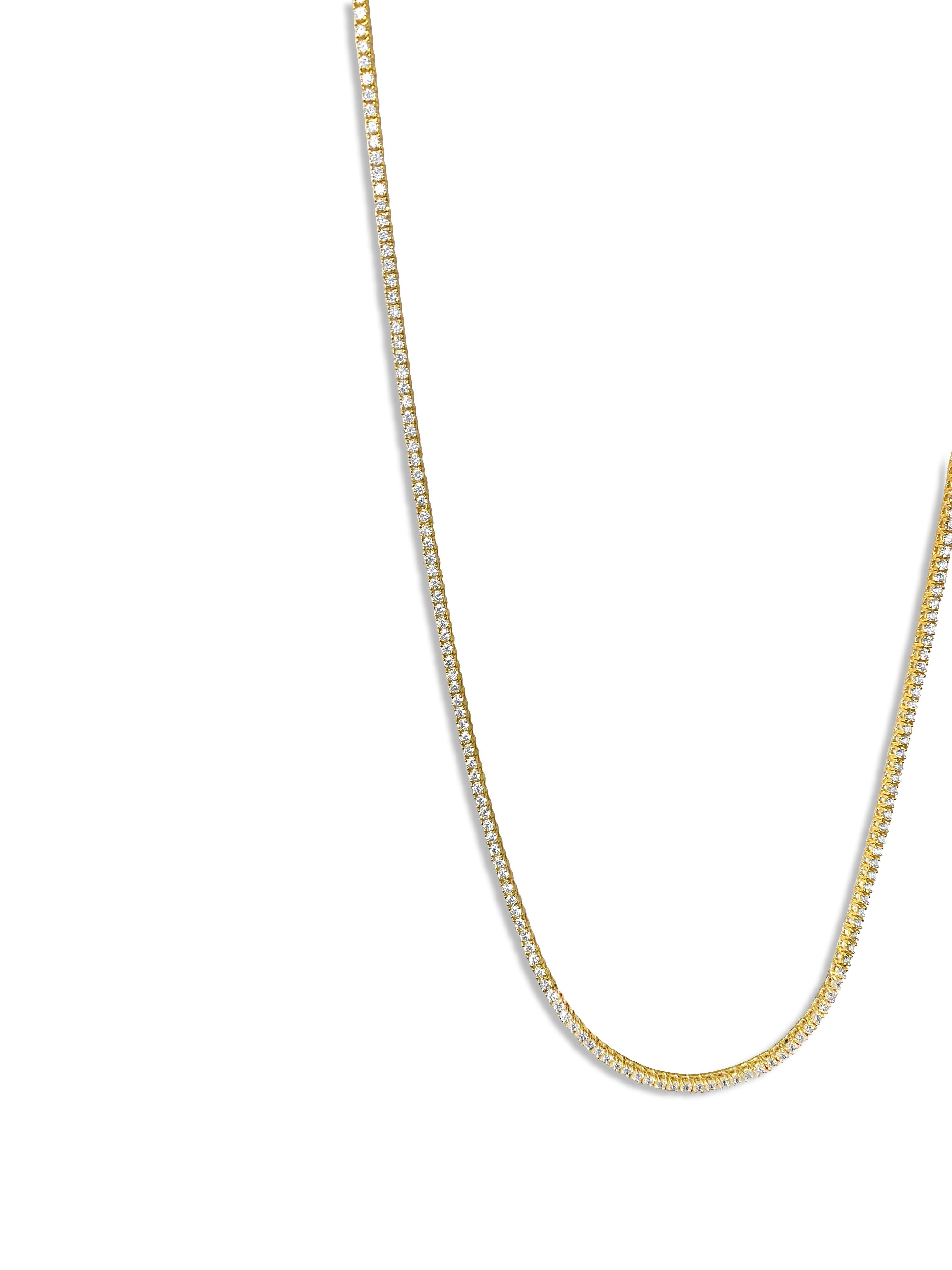 This necklace is made of 14-karat yellow gold. The diamonds on it weigh a total of 9 carats and have very high clarity (VVS-VS) and color (H). These diamonds are all-natural and mined from the earth. They are cut in a round brilliant style and set