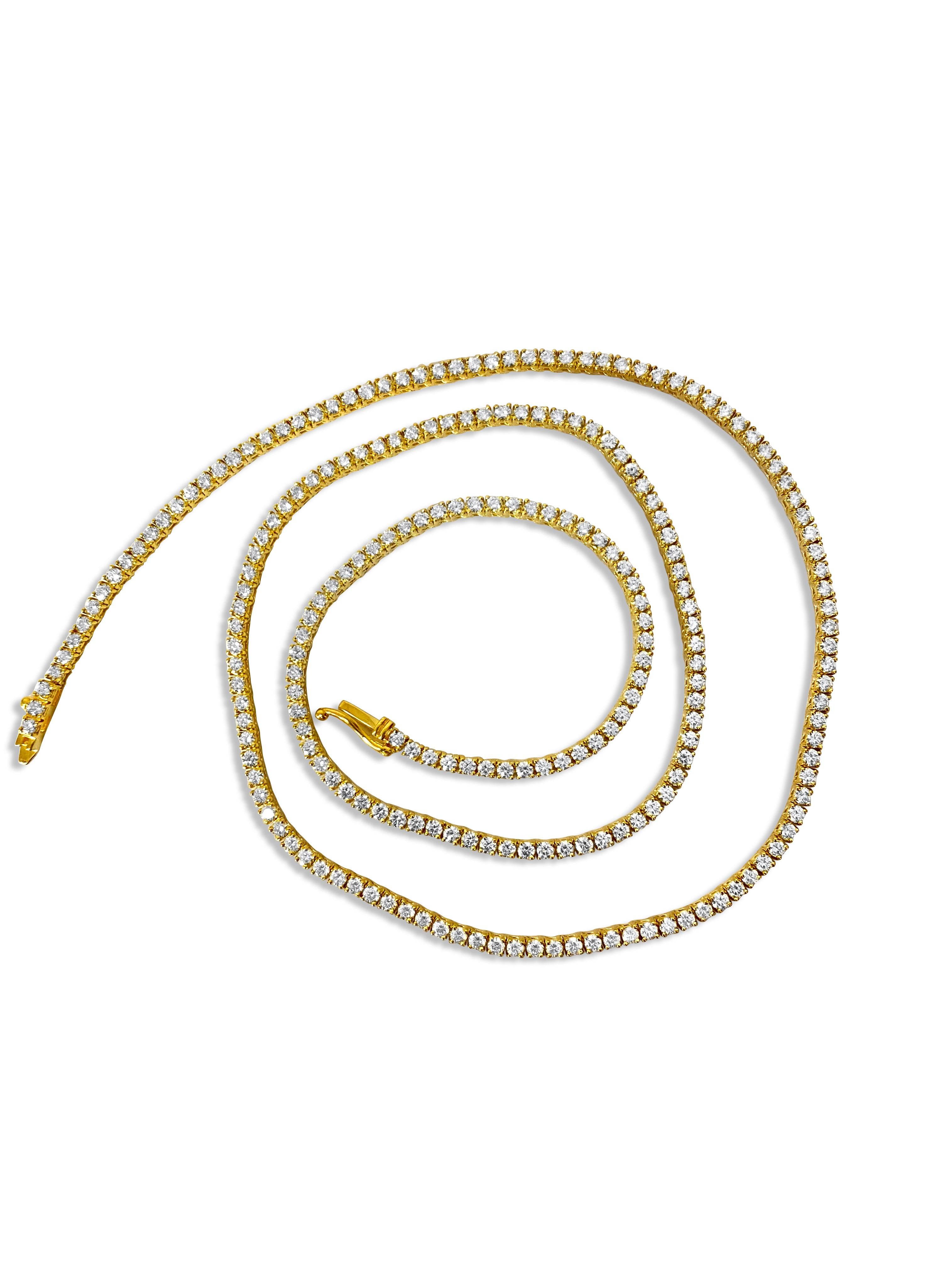 This necklace is made of 14-karat yellow gold. The diamonds on it weigh a total of 9 carats and have very high clarity (VVS-VS) and color (H). These diamonds are all-natural and mined from the earth. They are cut in a round brilliant style and set