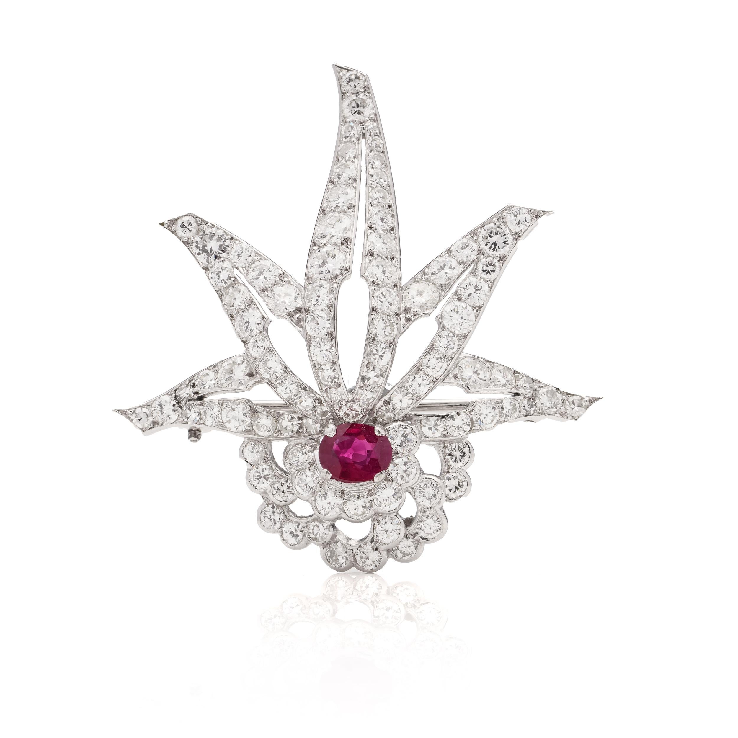  900. platinum brooch set with 4.62 carats of round brilliant diamonds and oval faceted ruby. 

X-Ray has tested positive for 900. Platinum. 
Dimensions:
4.5 x 4.2 x 1.2 cm 
Weight: 9.53 grams

Diamonds - 
Cut: Brilliant 
Approx. Quantity of stones: