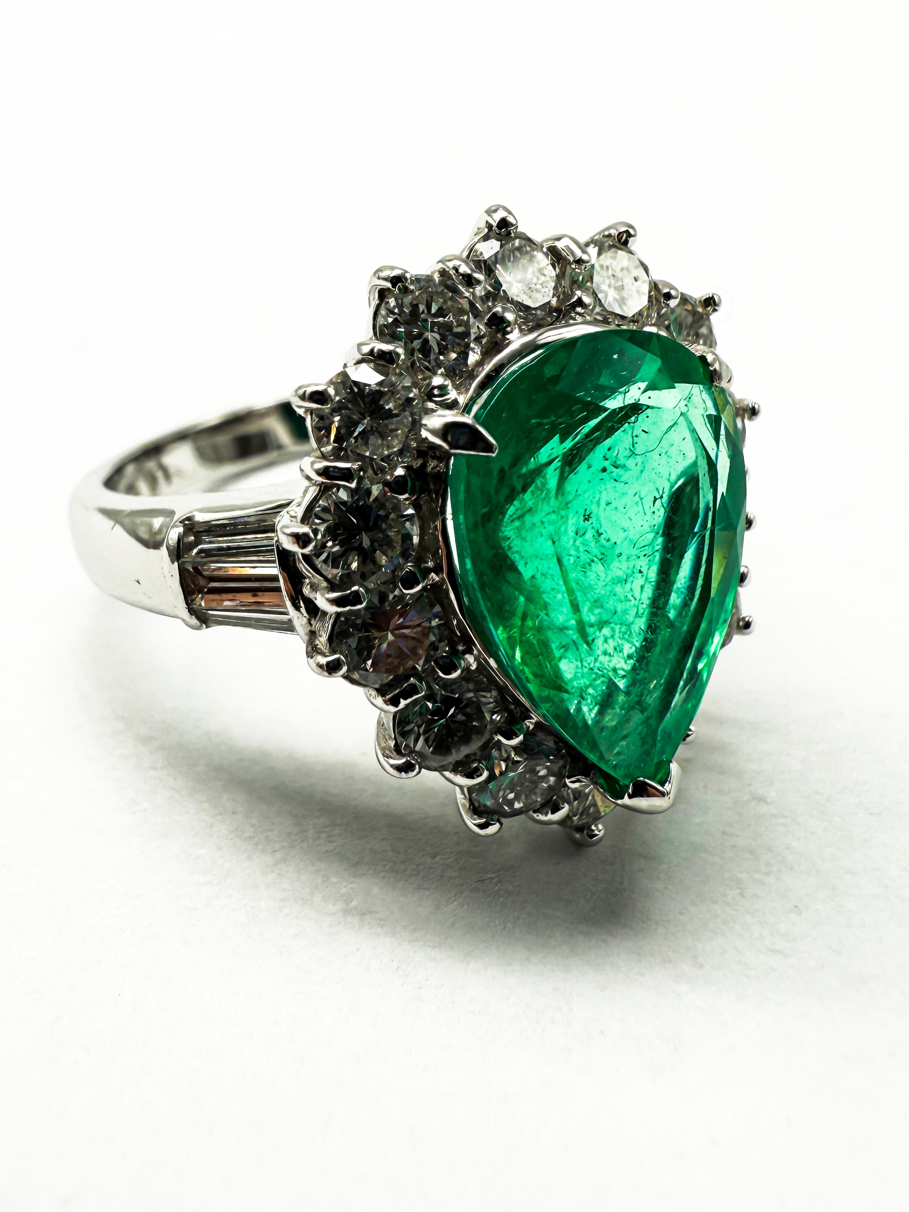 Pear Cut 900 Platinum Ring Featuring Emeralds and Diamonds For Sale