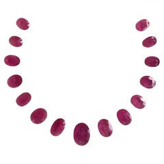 90.05 Carats Ruby Mozambique Oval Faceted Cut stone Layout Heated Natural Gem