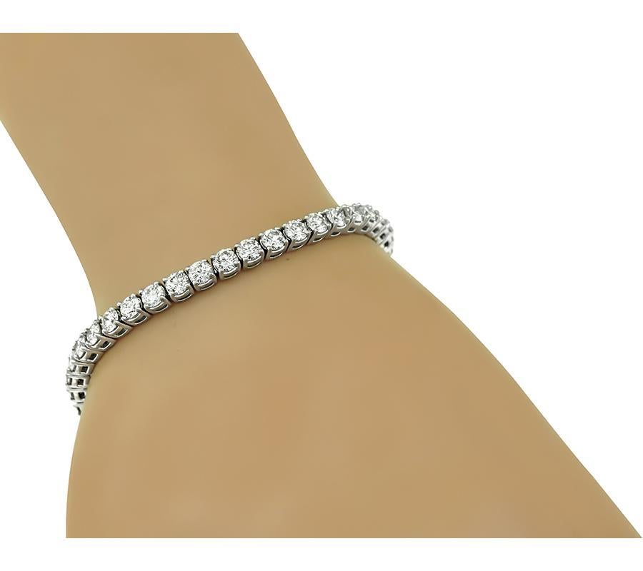 This is a beautiful 14k white gold tennis bracelet. The bracelet is set with sparkling round cut diamonds that weigh approximately 9.00ct. The color of the diamonds is H-J with VS clarity. The bracelet measures 7 inches in length and 4mm in width.