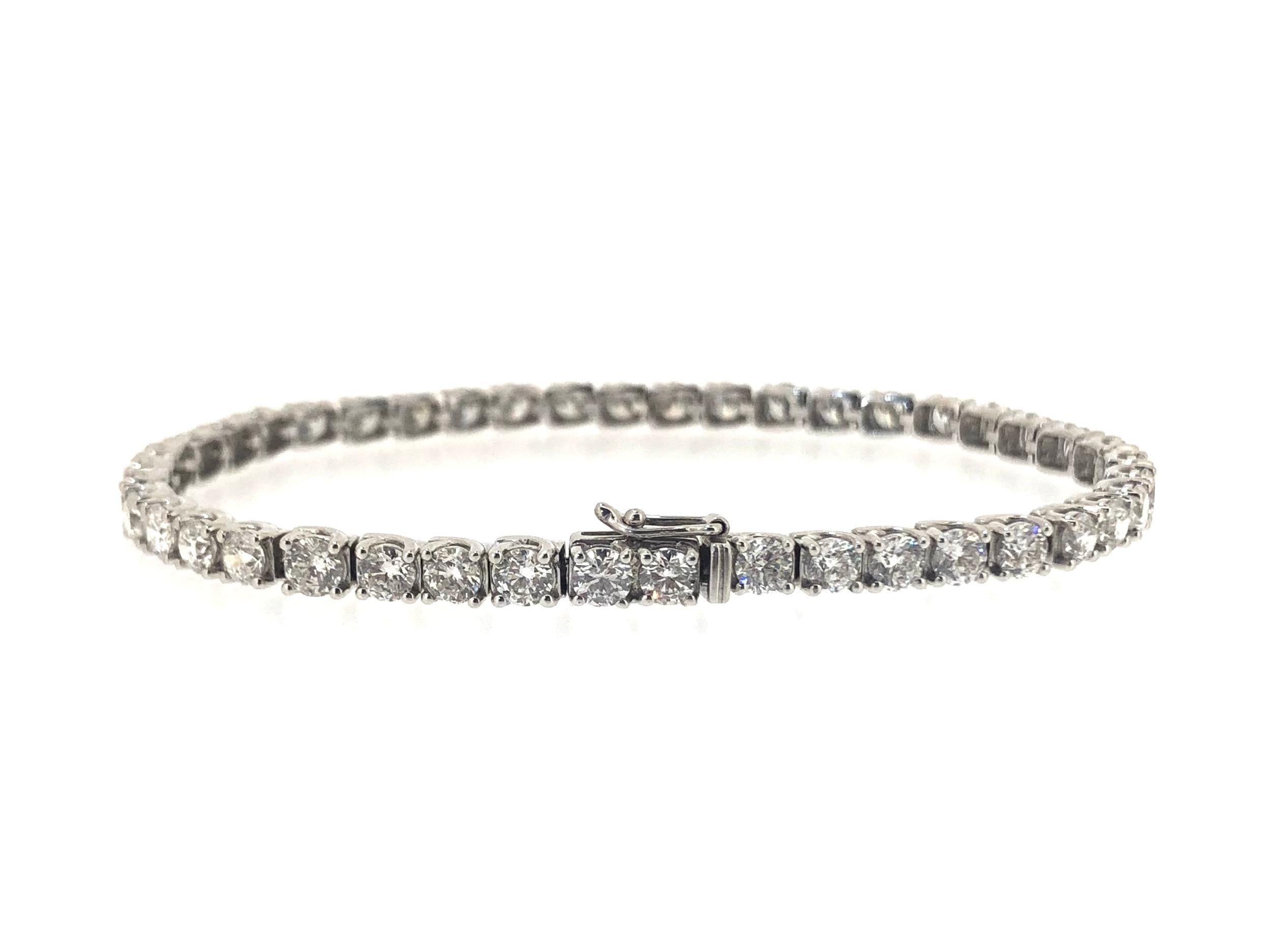 Beautiful Diamond Line Bracelet. Set with 43 round brilliant cut diamonds in 18ct white gold. With an integral clasp and safety catch. 

Approximate total diamond weight : 9.00ct
Grade : VS
Colour : G

Approximate length : 18.5cm
Approximate width :