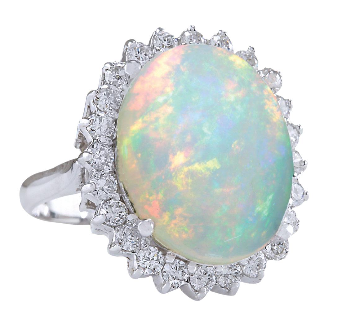Stamped: 14K White Gold
Total Ring Weight: 6.2 Grams
Total Natural Opal Weight is 7.81 Carat (Measures: 18.00x13.00 mm)
Color: Multicolor
Total Natural Diamond Weight is 1.20 Carat
Color: F-G, Clarity: VS2-SI1
Face Measures: 22.10x19.10 mm
Sku: