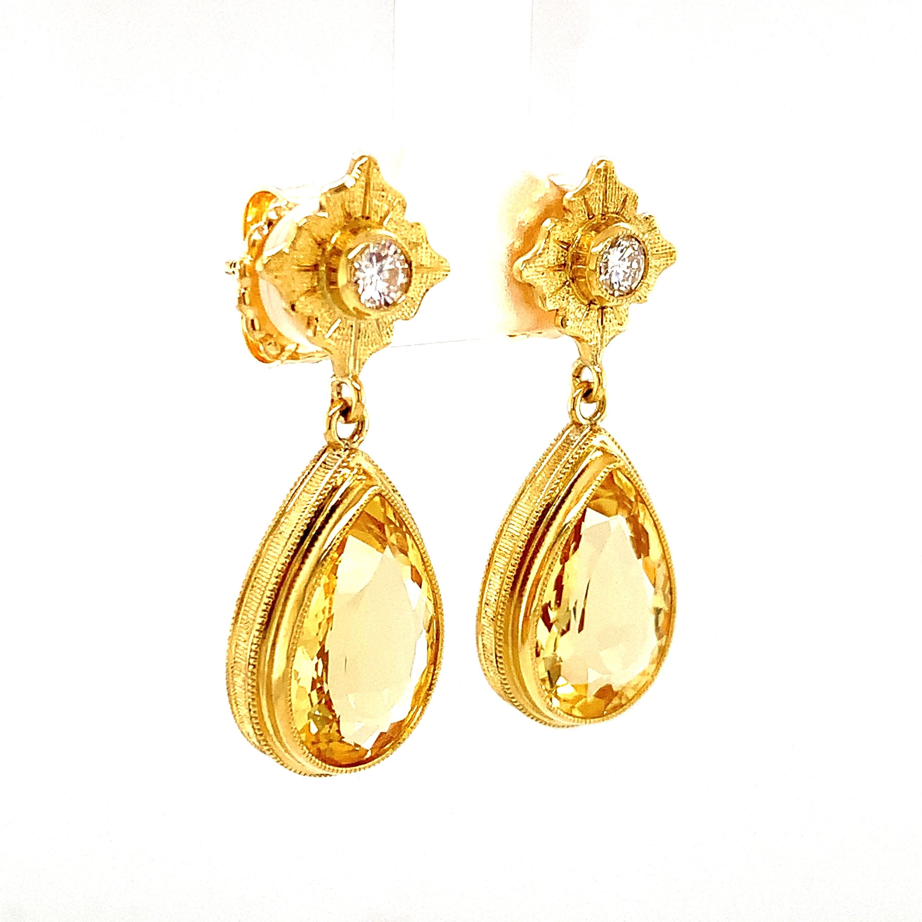 These golden beryl drop earrings are sophisticated and fun! They feature two beautifully matched pear-shaped golden beryls topped with brilliant white diamonds set in finely crafted 18k yellow gold settings. Golden beryls are cousins to emeralds and