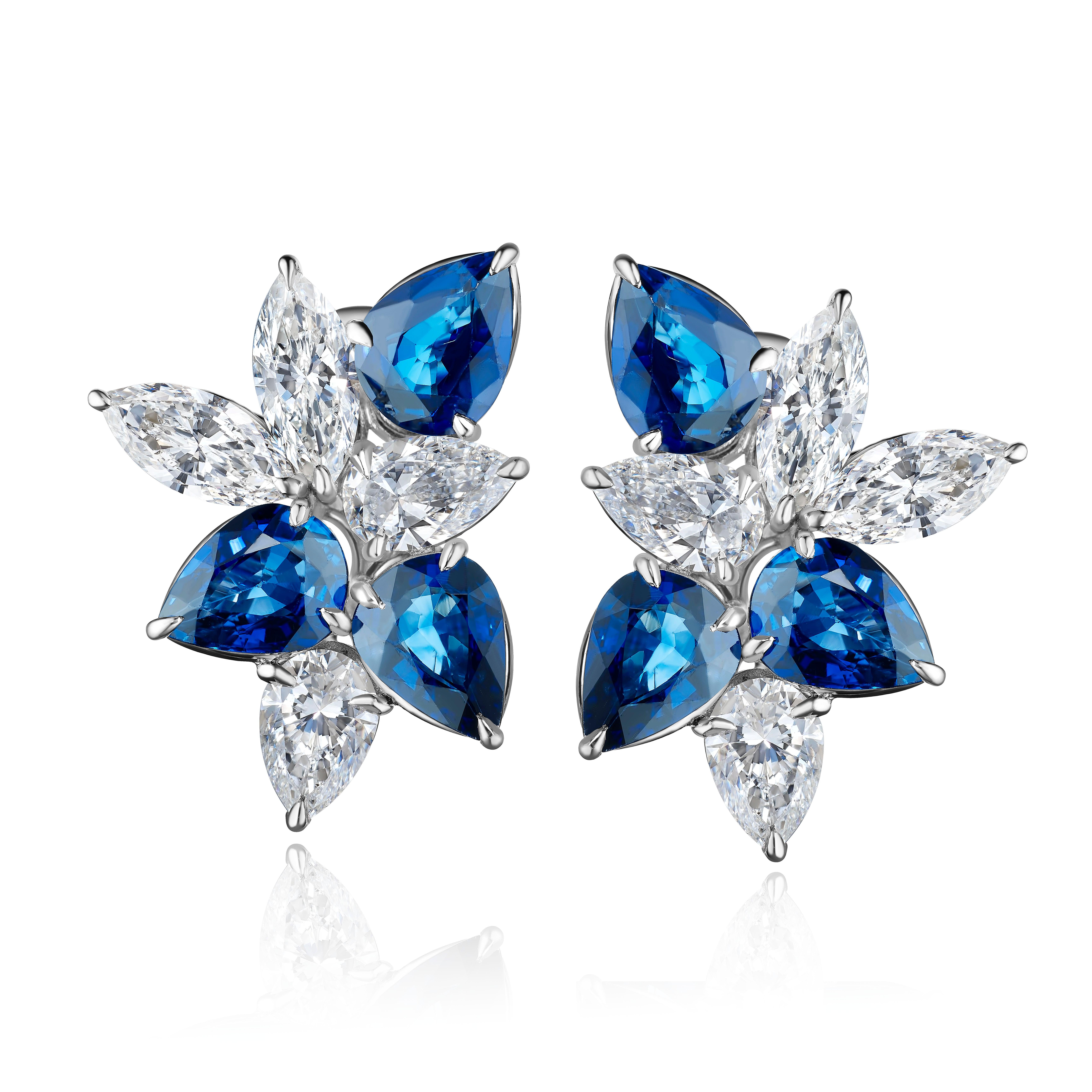 The Classic Cluster Earring. Redefined. Set with Sapphires and Diamonds and Set in Platinum and 18 Karat White Gold.

Sapphires totaling 5.34 Carats.
Diamonds Totaling 4.18 Carats.
9.52 Carats Total
