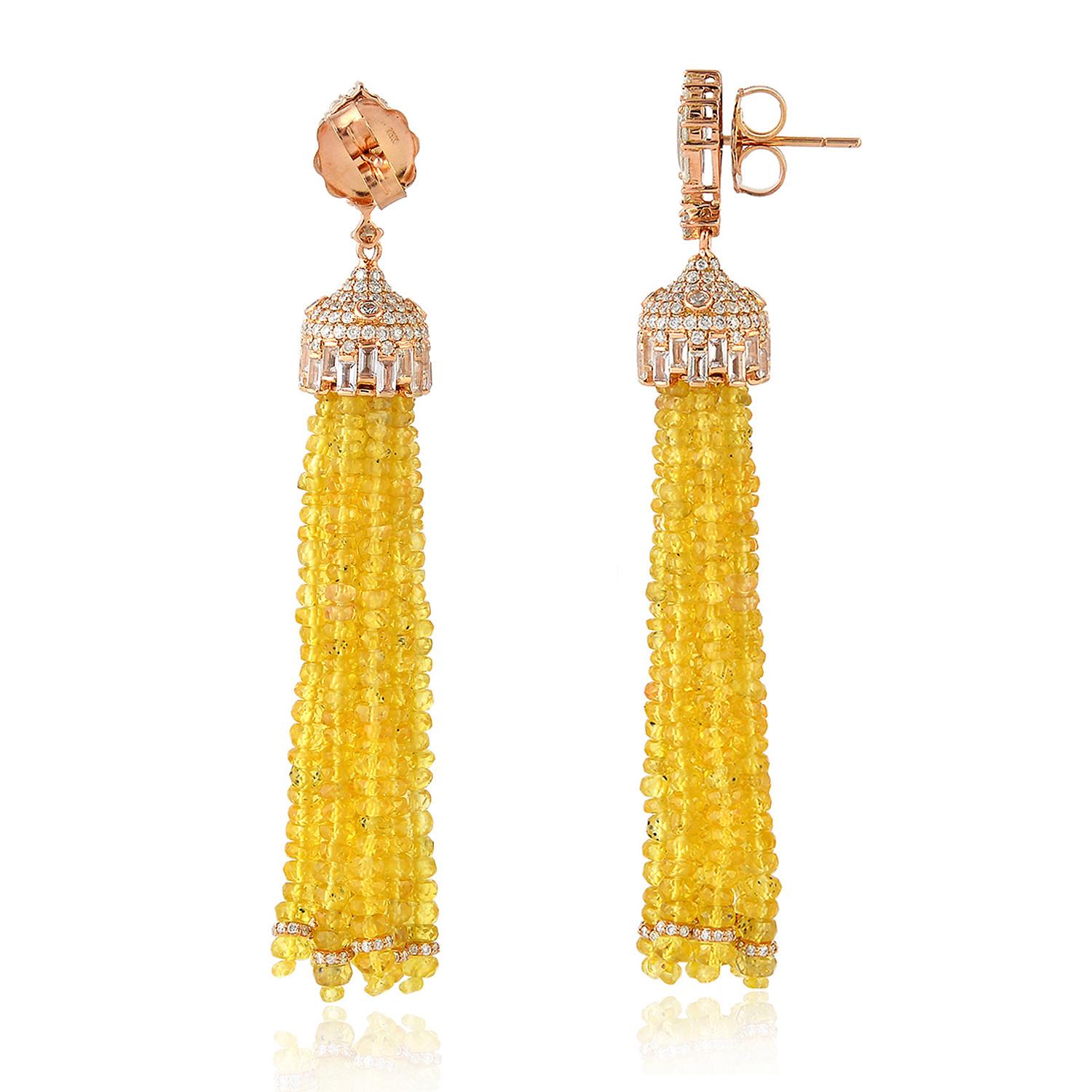 These stunning tassel earrings are handmade in 18-karat gold. It is set in 90.11 carats yellow sapphire and 2.73 carats of glittering diamonds. 

FOLLOW  MEGHNA JEWELS storefront to view the latest collection & exclusive pieces.  Meghna Jewels is