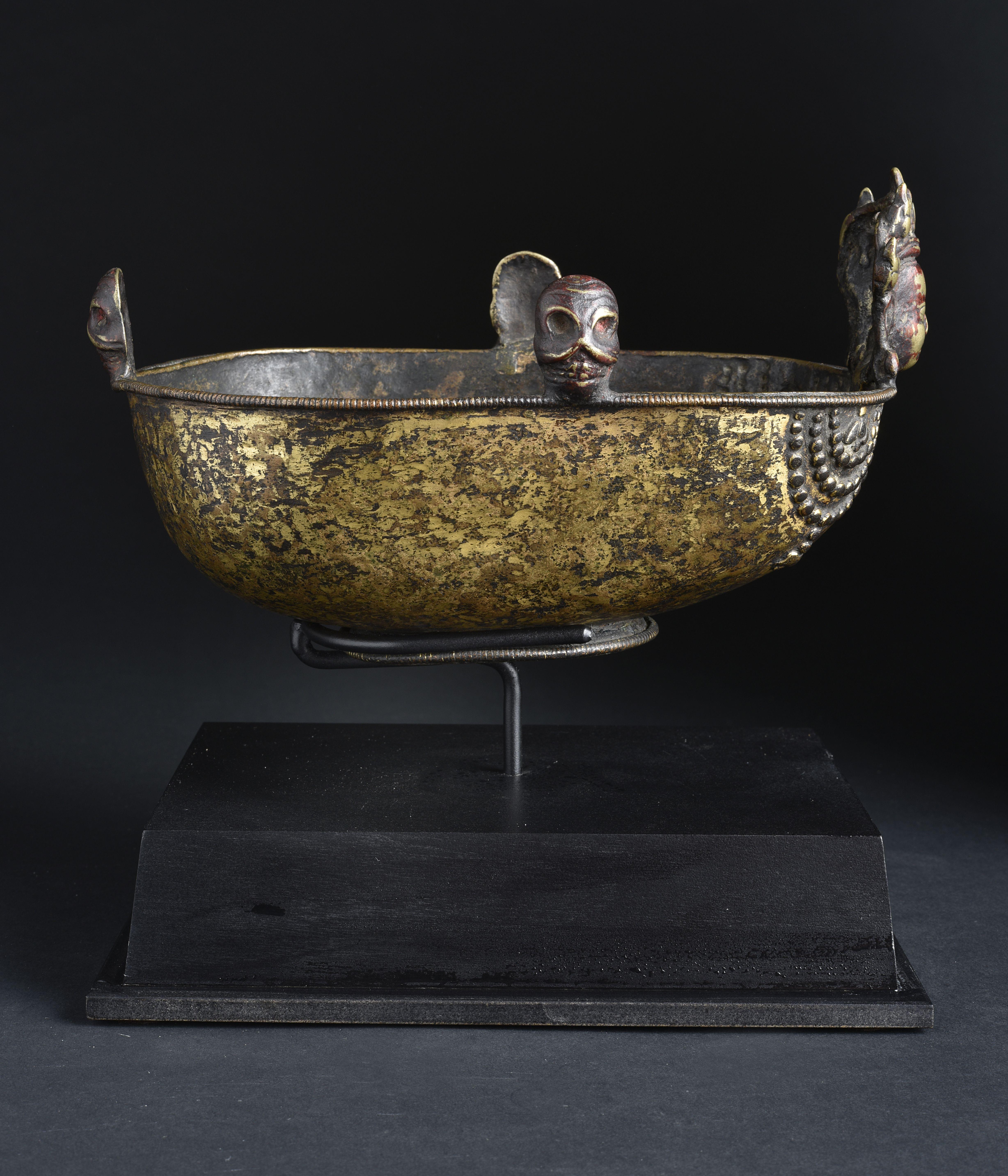 15-17thC Tibetan Bronze Skull Cup. Quite Large for its type (nearly life-size) at 8 inches deep,  6 inches wide,  and pproximately 5 inches tall. IT is 9 7/8 inches tall on a custom stand. Well-cast -possibly Newari Craftsman. Very good example.