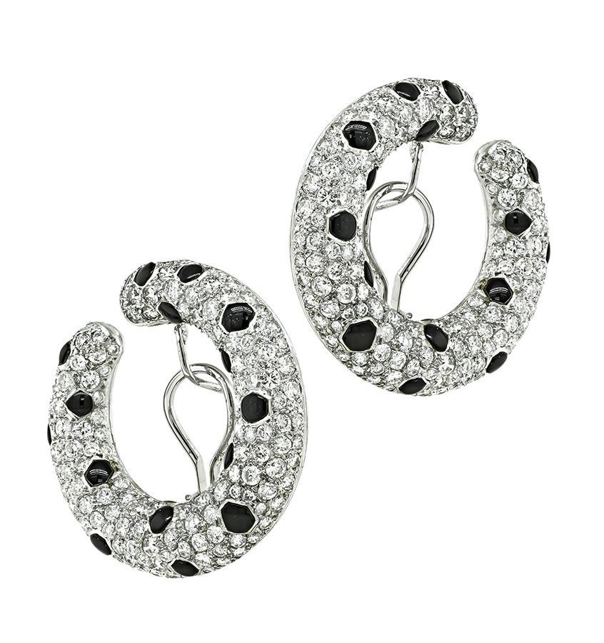This is an amazing pair of platinum earrings. The earrings feature sparkling round cut diamonds that weigh approximately 9.02ct. The color of these diamonds is H with VS clarity. The diamonds are accentuated by lovely onyx accents. The earrings