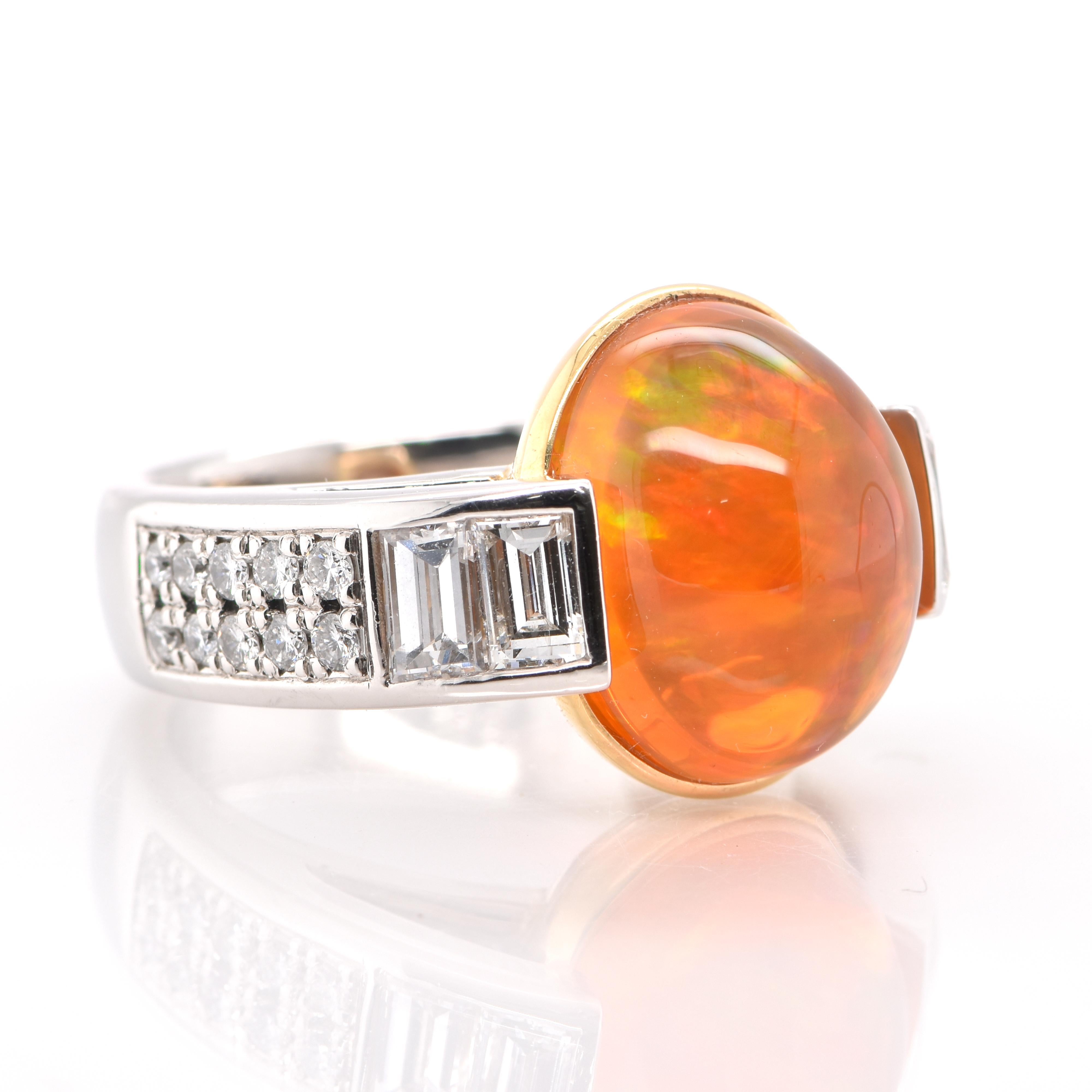 A beautiful Cocktail Ring featuring a 9.03 Carat, Natural Mexican Fire Opal with very good play of color and 1.20 Carats of Diamond Accents set in both Platinum and 18K Yellow Gold. Opals are known for exhibiting flashes of rainbow colors known as