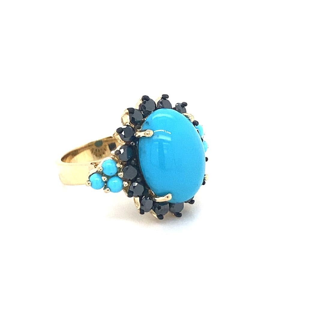 What a show stopper!!
9.03 Carat Turquoise Diamond Yellow Gold Cocktail Ring

This ring has a 6.91 Carat Oval Cut Turquoise and is surrounded by 16 Round Cut Black Diamonds that weigh 1.67 Carats and 6 Turquoise stones that weigh 0.45 Carats.   The