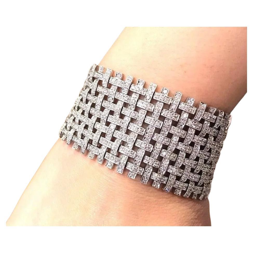 9.03 Carat Wide Basket Weave Diamond Bracelet in 18K White Gold

Wide Basket Weave Diamond Bracelet features a flexible design with a basket weave pattern adorned with 9.03 Carats of Round Brilliant cut Diamonds Pave set in 18k White Gold with