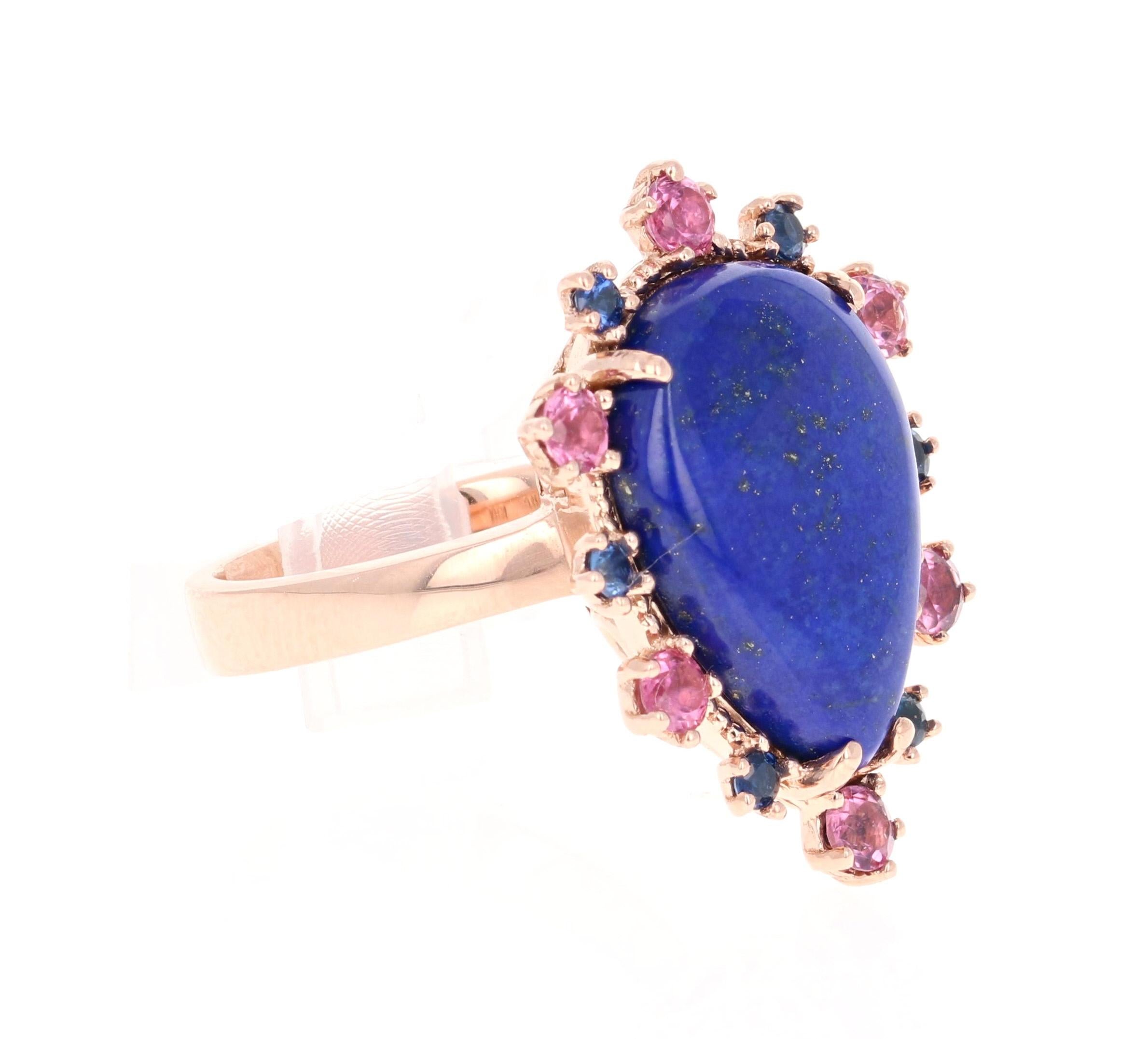 9.04 Carat Lapis Lazuli Tourmaline and Sapphire Cocktail Rose Gold Ring

A beauty to say the least! This unique ring has a beautiful deep blue/purple Pear Cut Lapis Lazuli that weighs 8.13 Carats. It is surrounded by 6 Tourmalines that weigh 0.65
