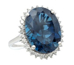 9.04 Carat Oval Blue Topaz Cocktail Ring with Diamond Halo 14 Karat White Gold