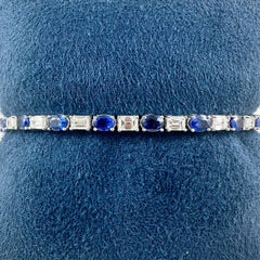 Bracciale Tennis con zaffiri ovali e diamanti taglio smeraldo da 9,05 carati in 14 carati