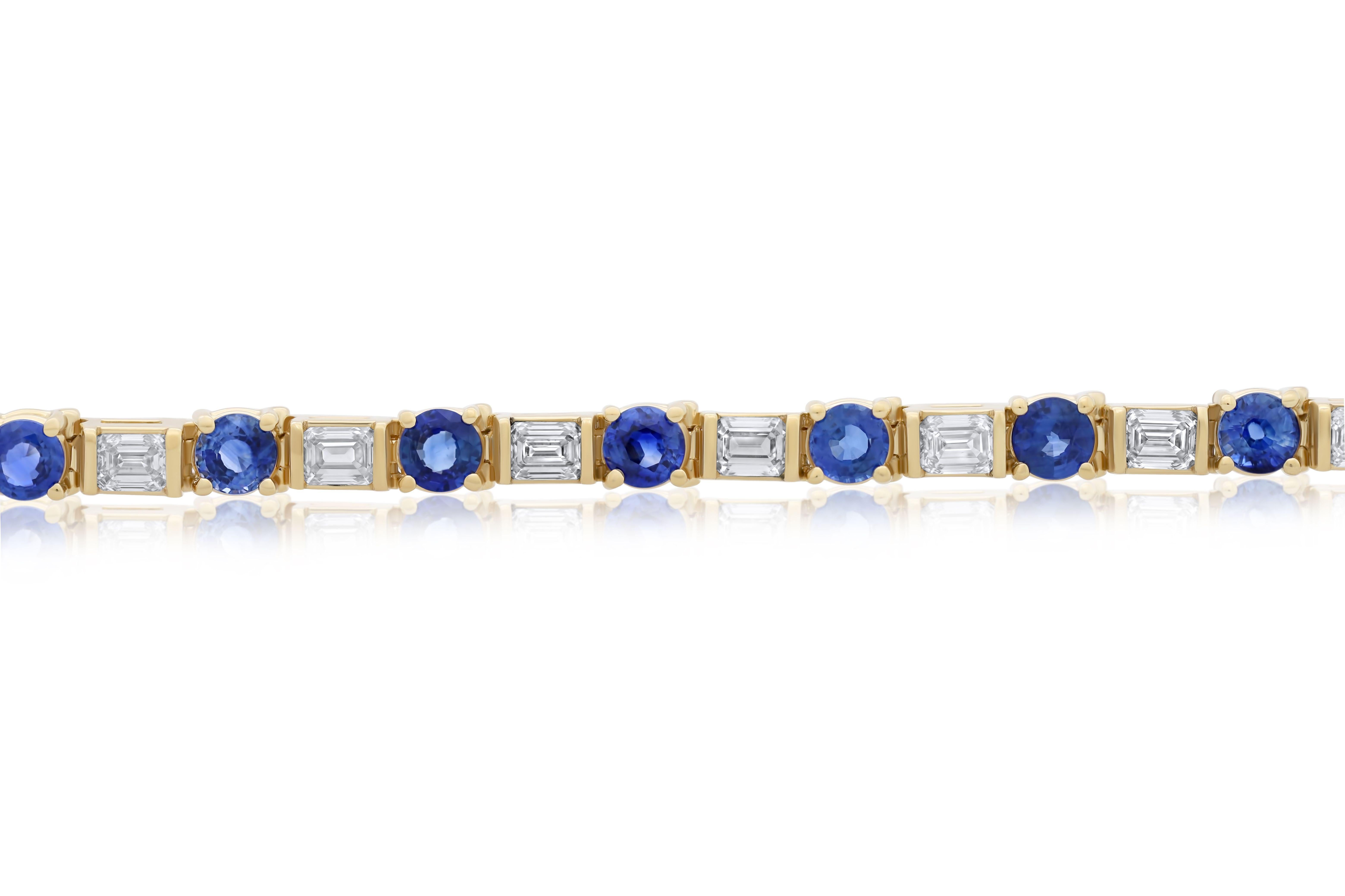 18 kt yellow gold sapphire and diamond eternity bracelet adorned with 9.05 cts tw of round sapphires separated by 6.05 cts tw of baguette cut diamonds