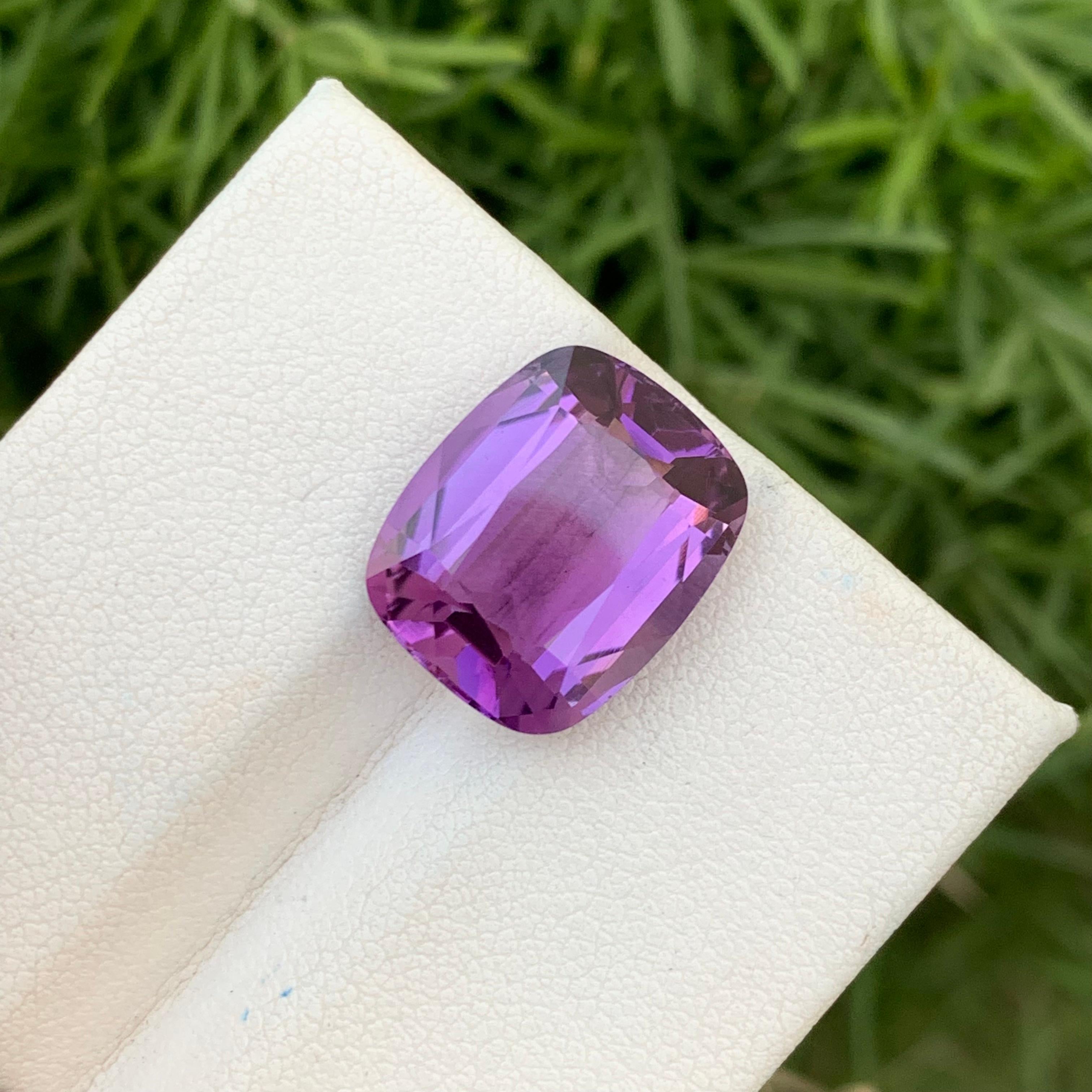 Loose Amethyst 
Weight: 9.05 Carats 
Dimension: 15.1x12.3x7.3 Mm
Origin: Brazil
Shape: Cushion
Color: Purple
Treatment: Non
Certificate: On Customer Demand
Amethyst, a stunning purple-hued quartz, is a beloved gemstone coveted for its beauty and