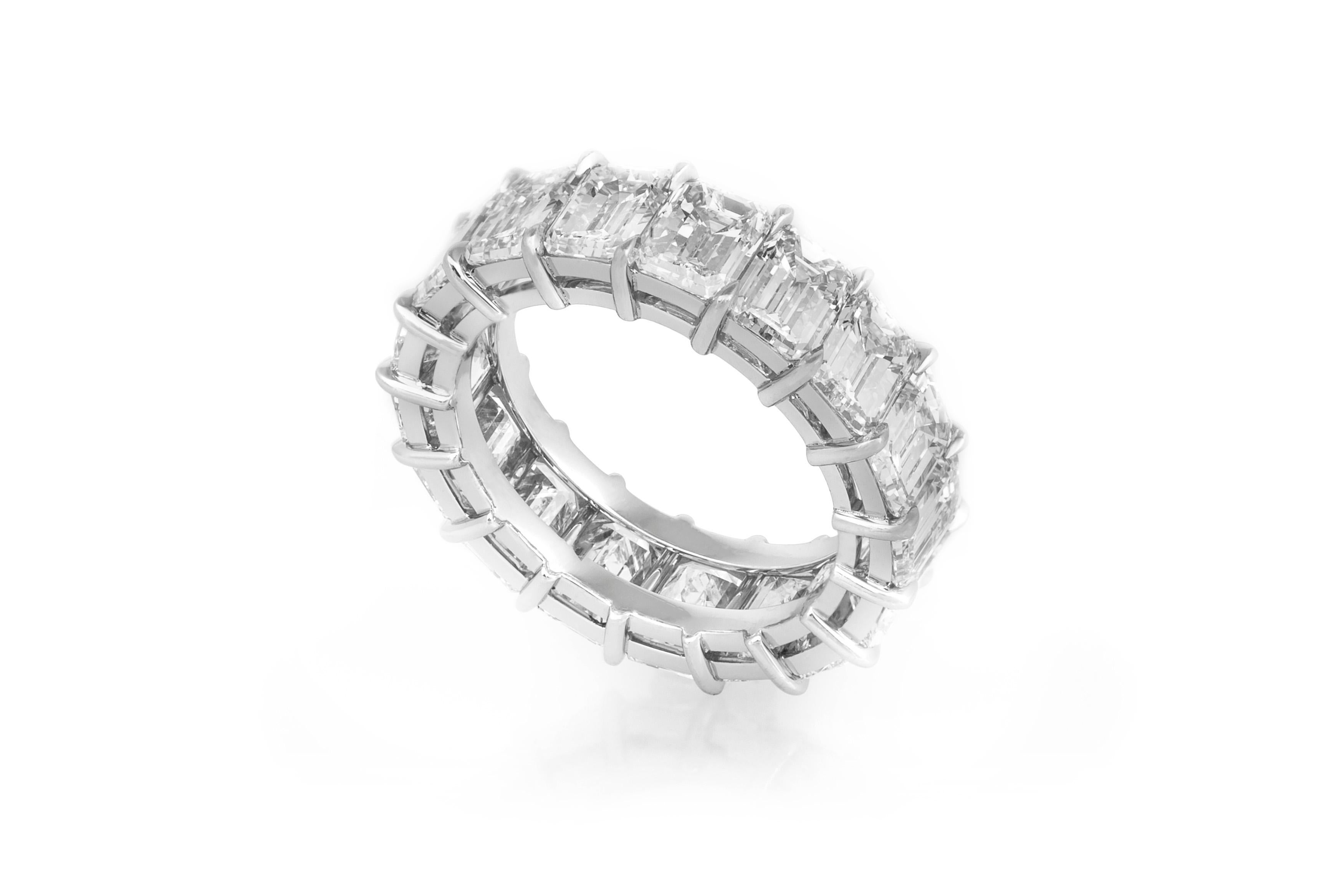 Estate Platinum Eternity Ring features 17 emerald cut diamonds, weighing a total of 9.06 carats. Ring Size 5.5. May be sized upon request. Additional charges may apply. Circa 1990's.