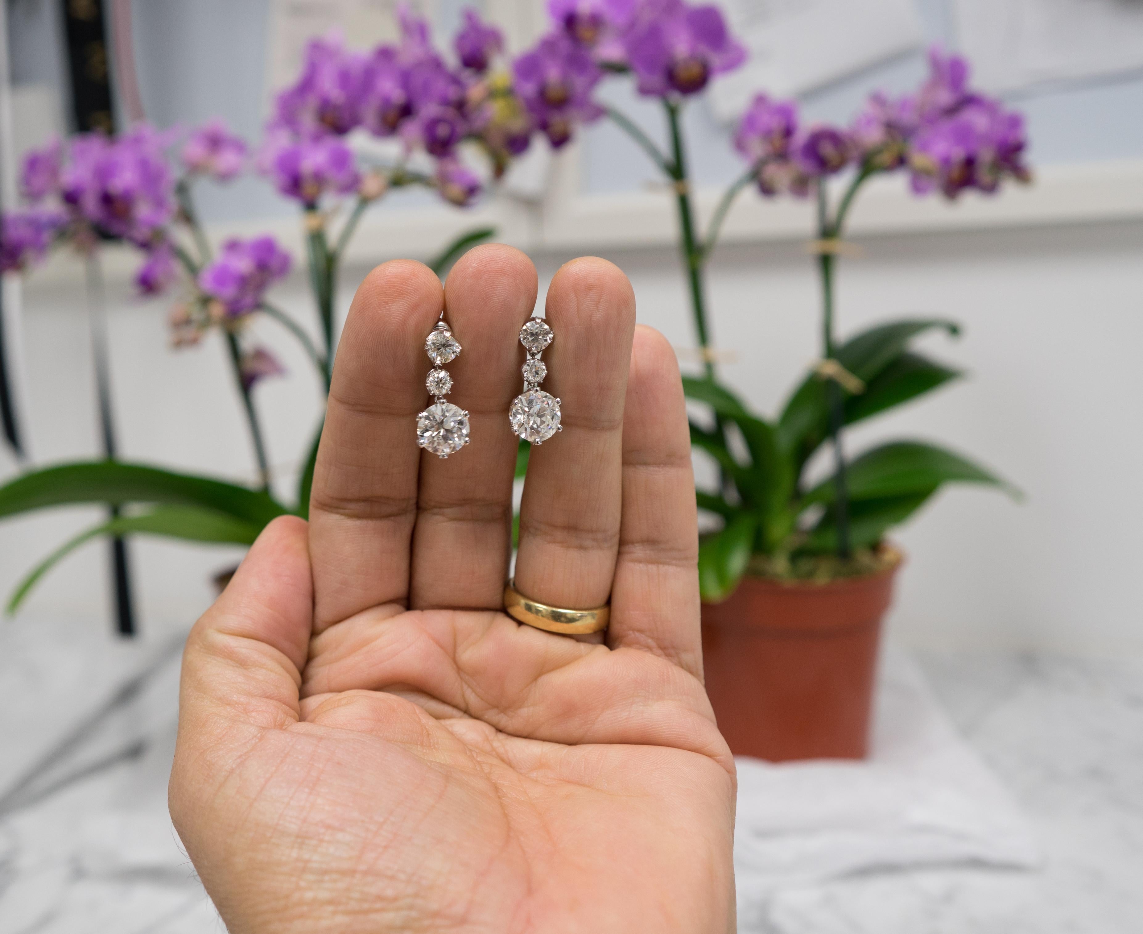 9.07 Carat total weight Dangling Old European Cut Diamond Earrings in Platinum
Pair of dangling earrings with 2 matched Old European Cut center diamonds weighing 6.93 carats total  complemented with 2 pairs of Old European Cut accent diamonds