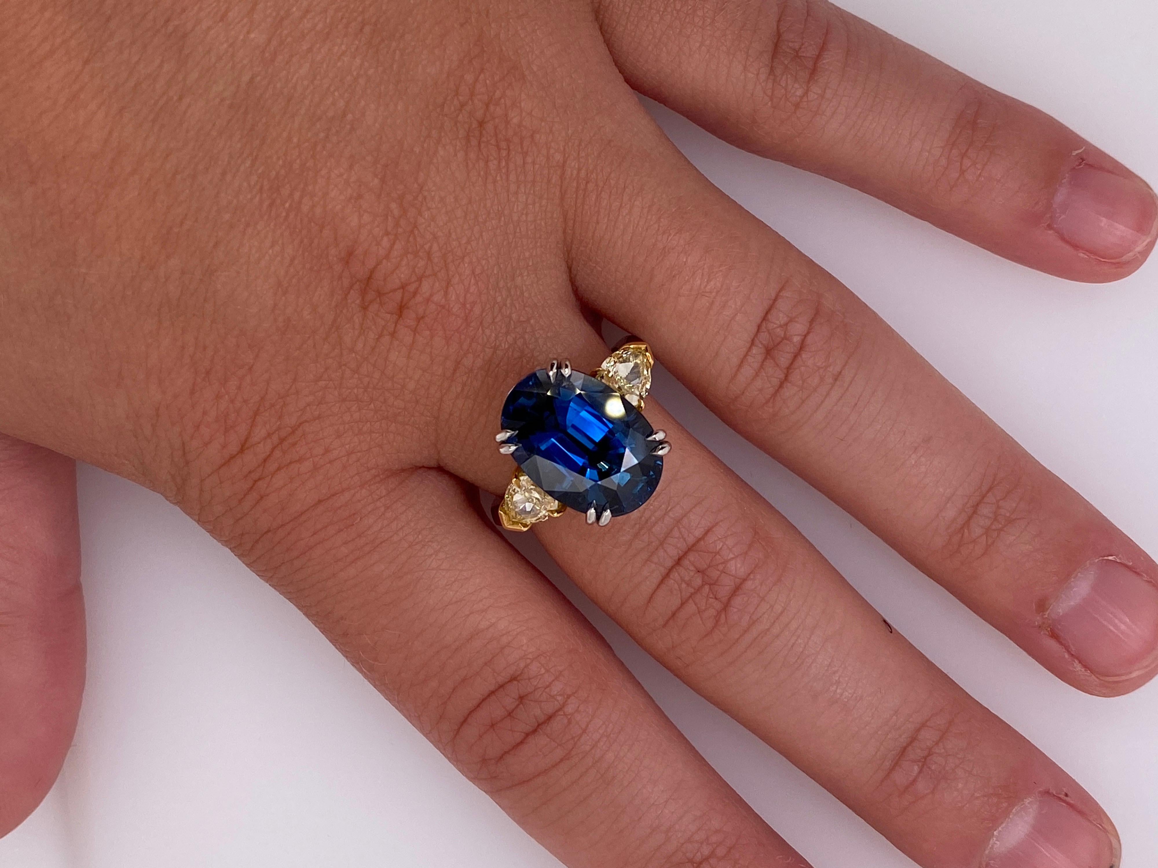 Contemporary 9.08 Carat Oval Blue Sapphire and Fancy Yellow Diamond Platinum and 18k Ring For Sale