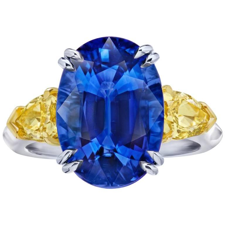 9.08 Carat Oval Blue Sapphire and Fancy Yellow Diamond Platinum and 18k Ring For Sale