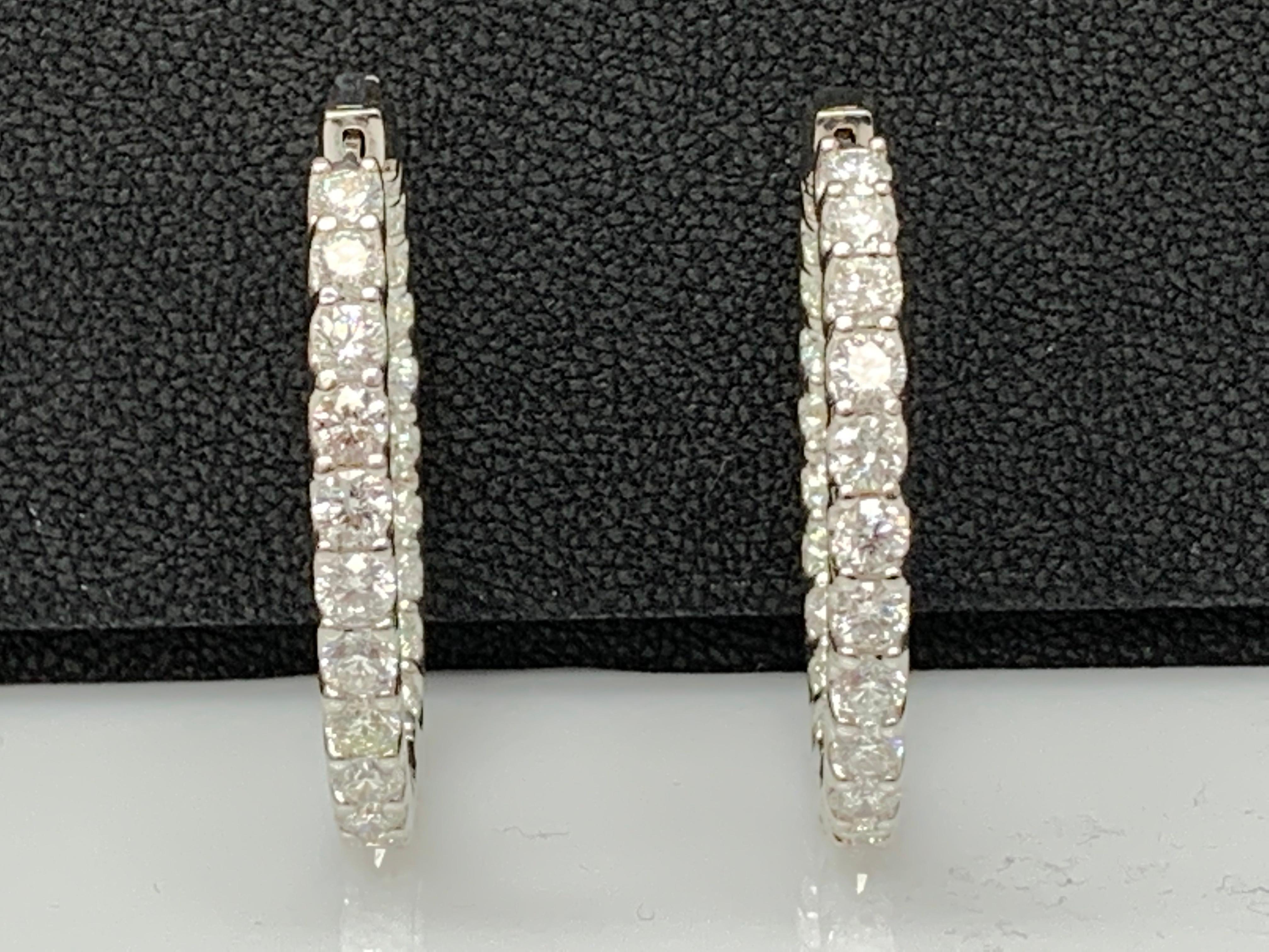 A chic and fashionable pair of hoop earrings showcasing brilliant cut diamonds, set in 14k yellow gold. 46 Round diamonds weigh 9.08 carats total. A beautiful piece of jewelry.


All diamonds are GH color SI1 Clarity.
Available in Yellow and Rose