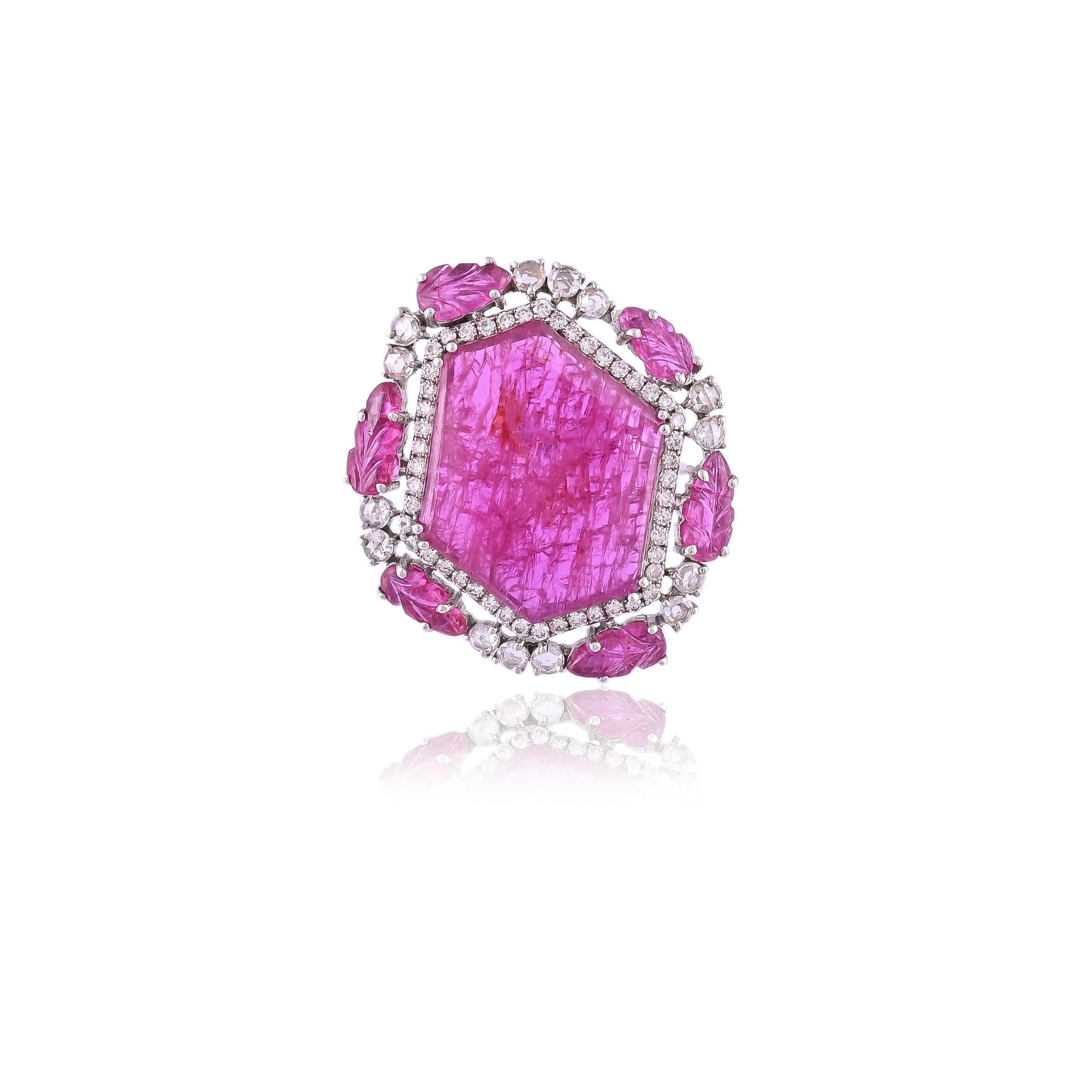A very beautiful Ruby and Diamonds Cocktail Ring set in 18K Gold & Diamonds. The Ruby is of Mozambique origin and is completely natural. The combined weight of the Ruby is 11.58 carats. The combined diamonds weight is 0.82 carats. The dimensions of