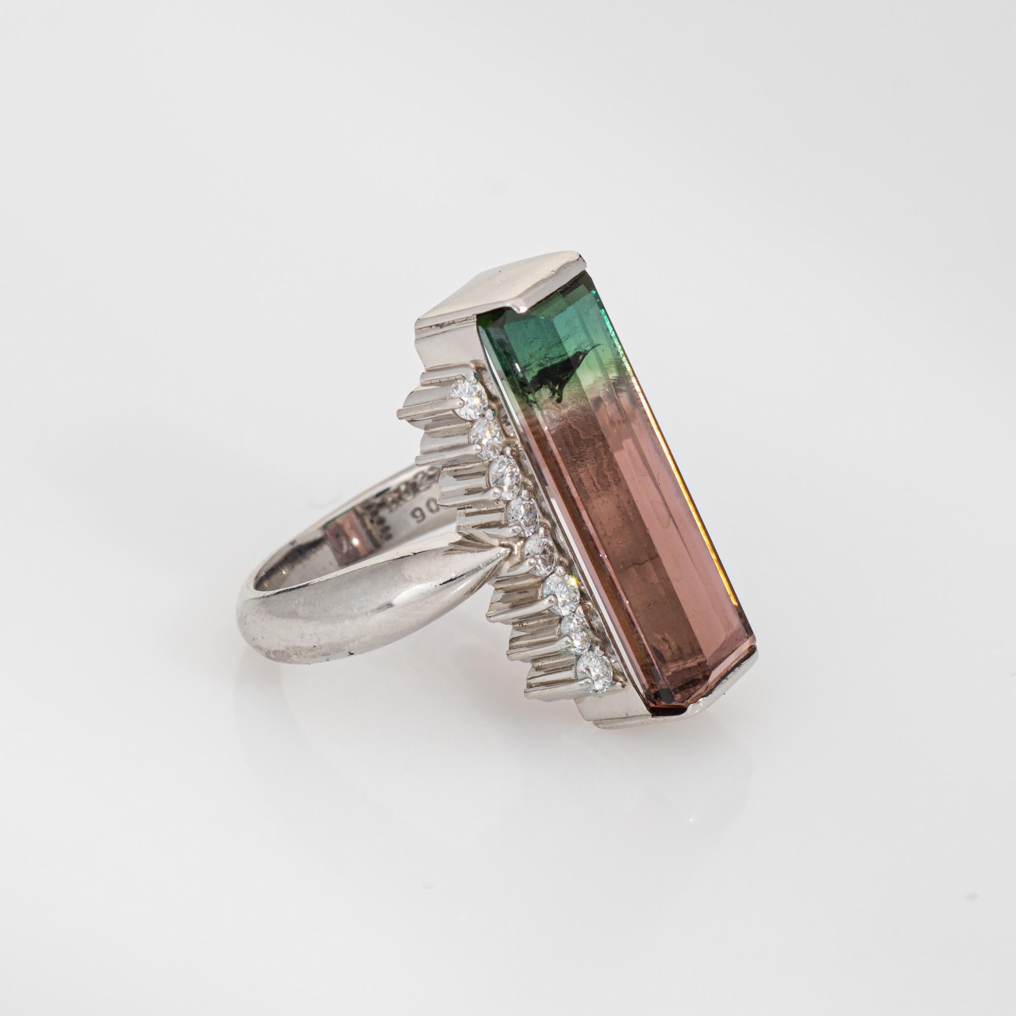 Stylish contemporary bi-color watermelon tourmaline & diamond ring (circa 2000s) crafted in 900 platinum. 

Bi color tourmaline measures 21mm x 7mm (estimated at 9.08 carats). 8 diamonds total an estimated 0.27 carats (estimated at H-I color and