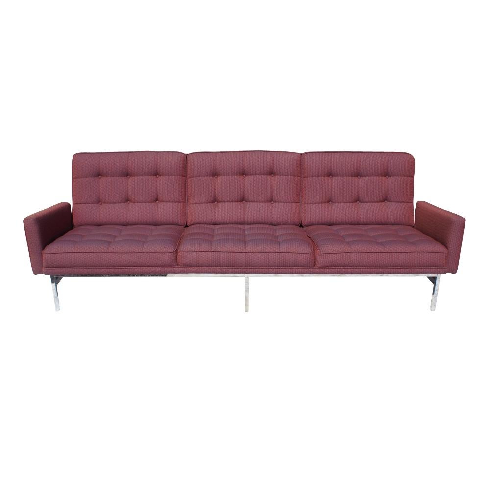 Iconic Florence Knoll three-seat sofa in original berry fabric.
Chrome legs.
Chrome has been restored. Measures: 90 in.
