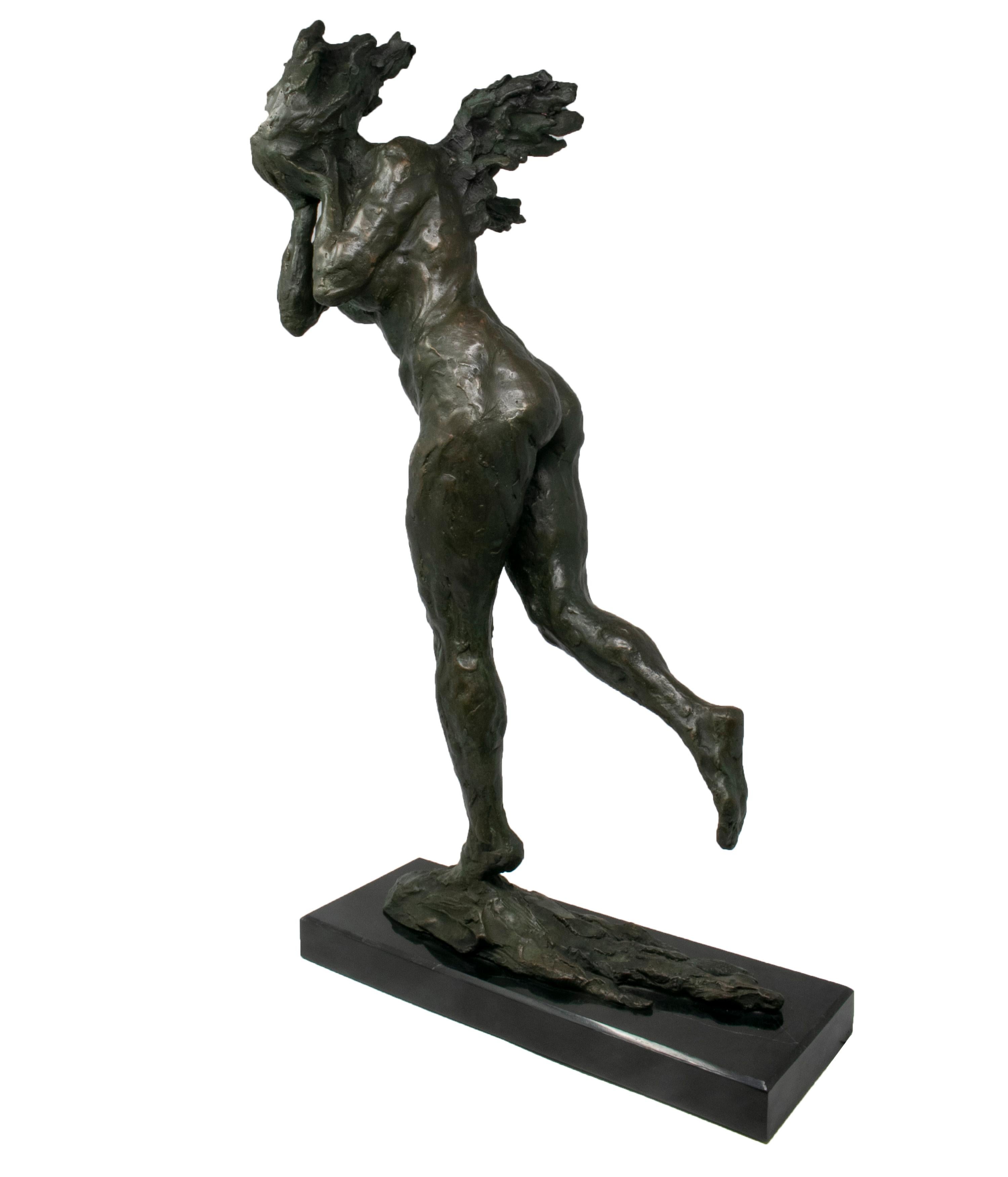 1990s abstract bronze figure of a woman running whilst covering her face, on a black marble base.