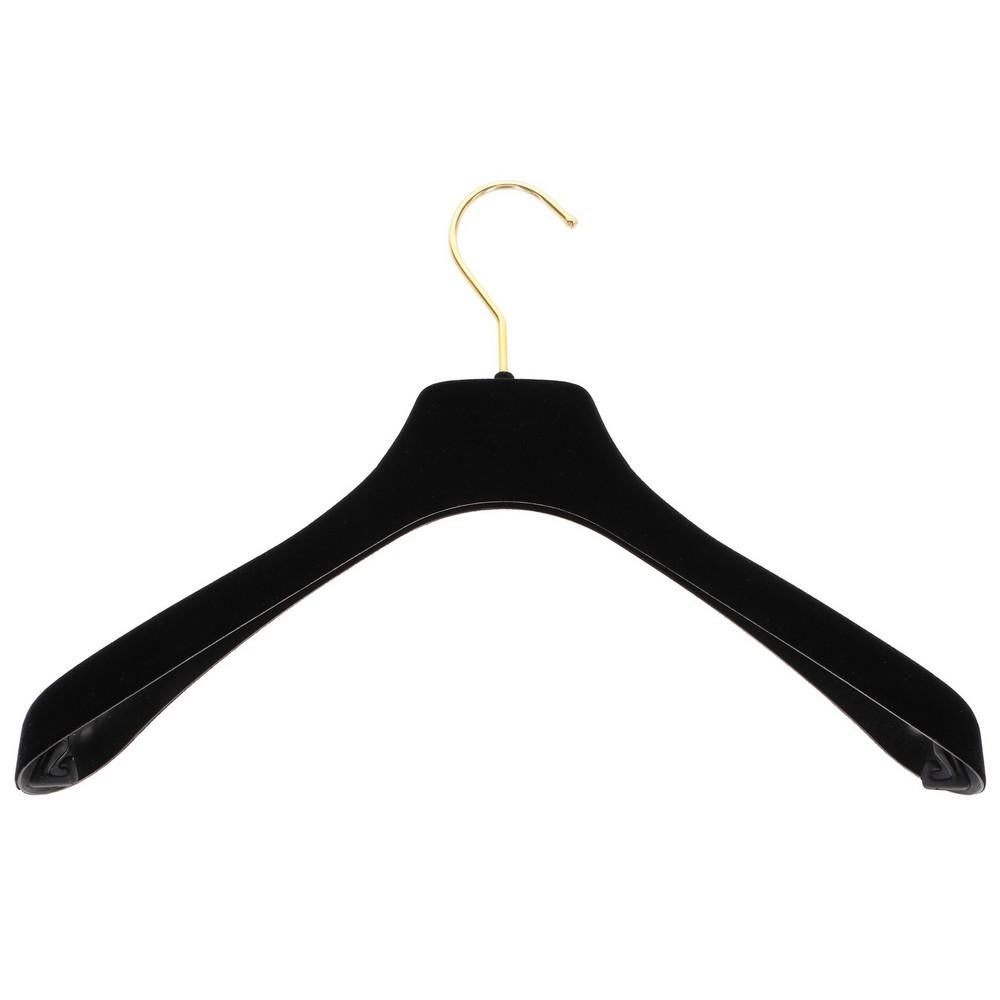 Chanel black velvet large clothes hanger. Frontal golden metal logo.

Measurements
Lenght: 40 cm
Bust: 2 cm

Product code: A5316

Composition: Plastic - Metal

Made in: France

Condition: Very good conditions