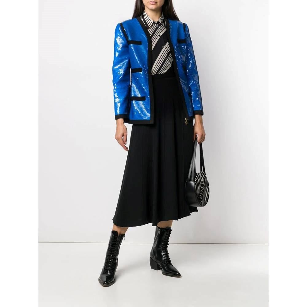 Chanel electric blue sequins 90s jacket with black grosgrain trims. V-neck, front zip fastening with with logoed charm puller and four faux welt pockets on the front.

Size: 42 IT

Flat measurements
Height: 67 cm
Bust: 46 cm
Waist: 42 cm
Sleeve: 58