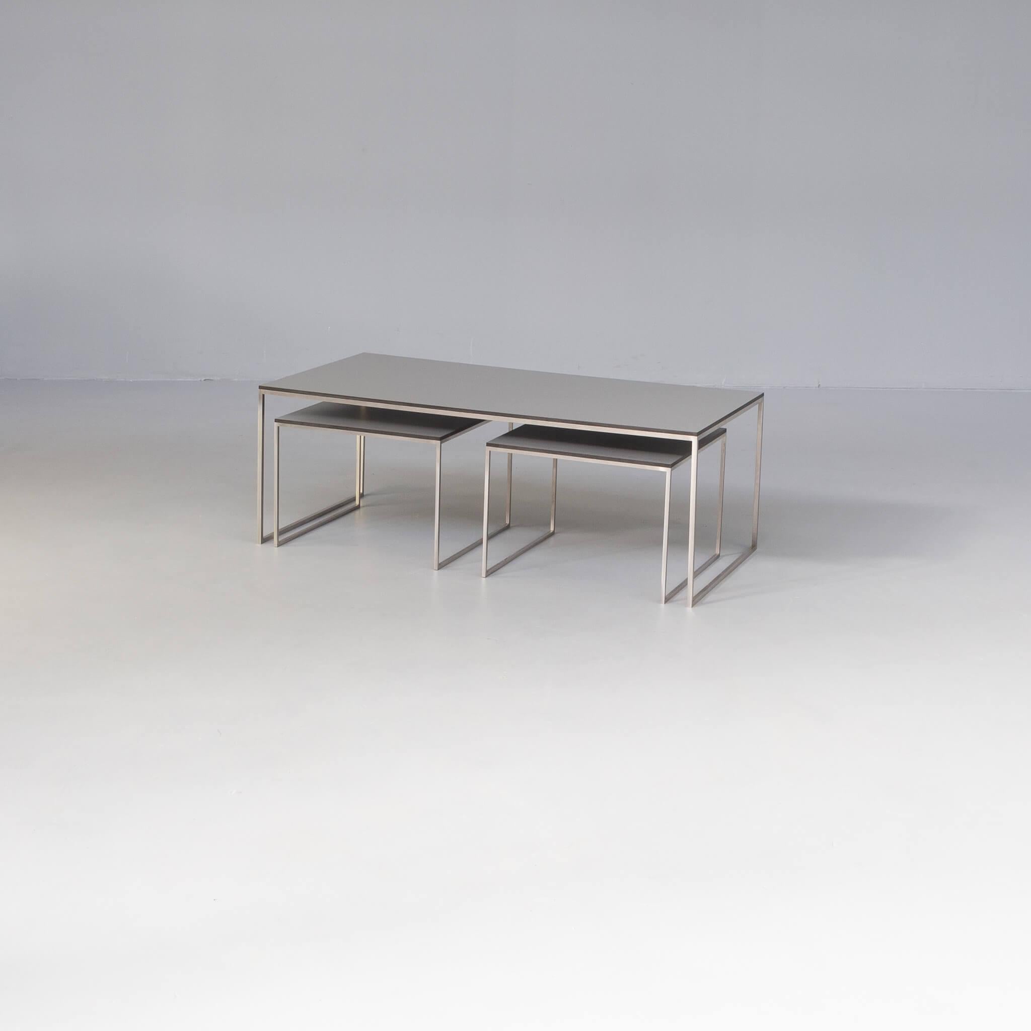 Beautiful thin lined nesting coffee table. The set of 3 tables is in 1 main large table with beautiful steel frame with unvisible welding, it looks like the frame is in 1 piece! very rare and beautiful. The two smaller tables are to be positioned