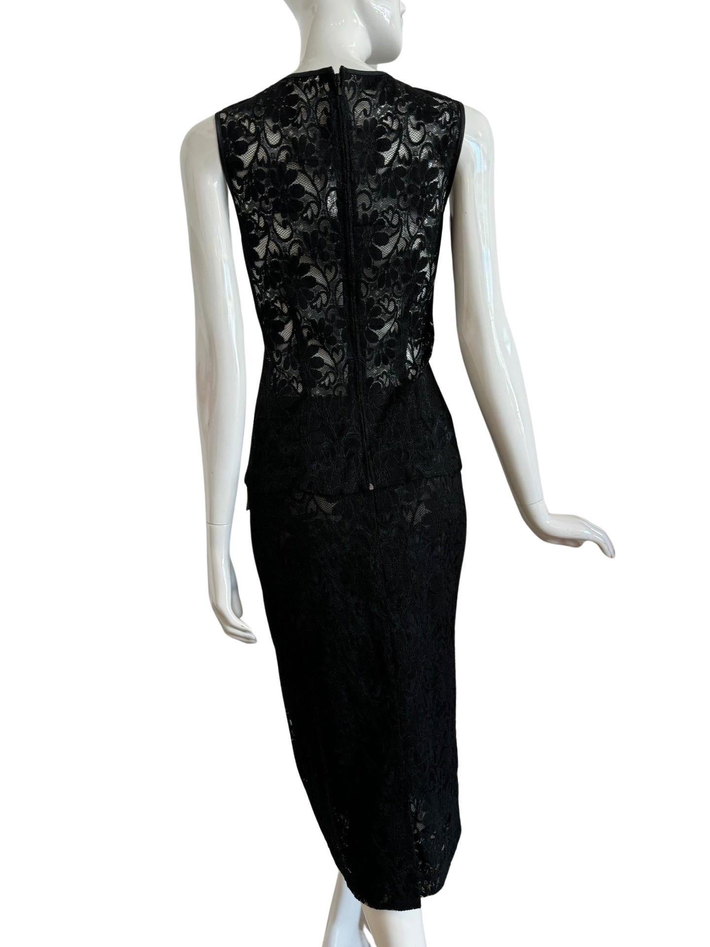 Dolce & Gabbana D&G label top and skirt black lace set. The top is a sleeveless shell and sheer with piping along the edges. It falls below the skirt line. The skirt is a pencil skirt past the knees and lined. Made in Italy and in excellent