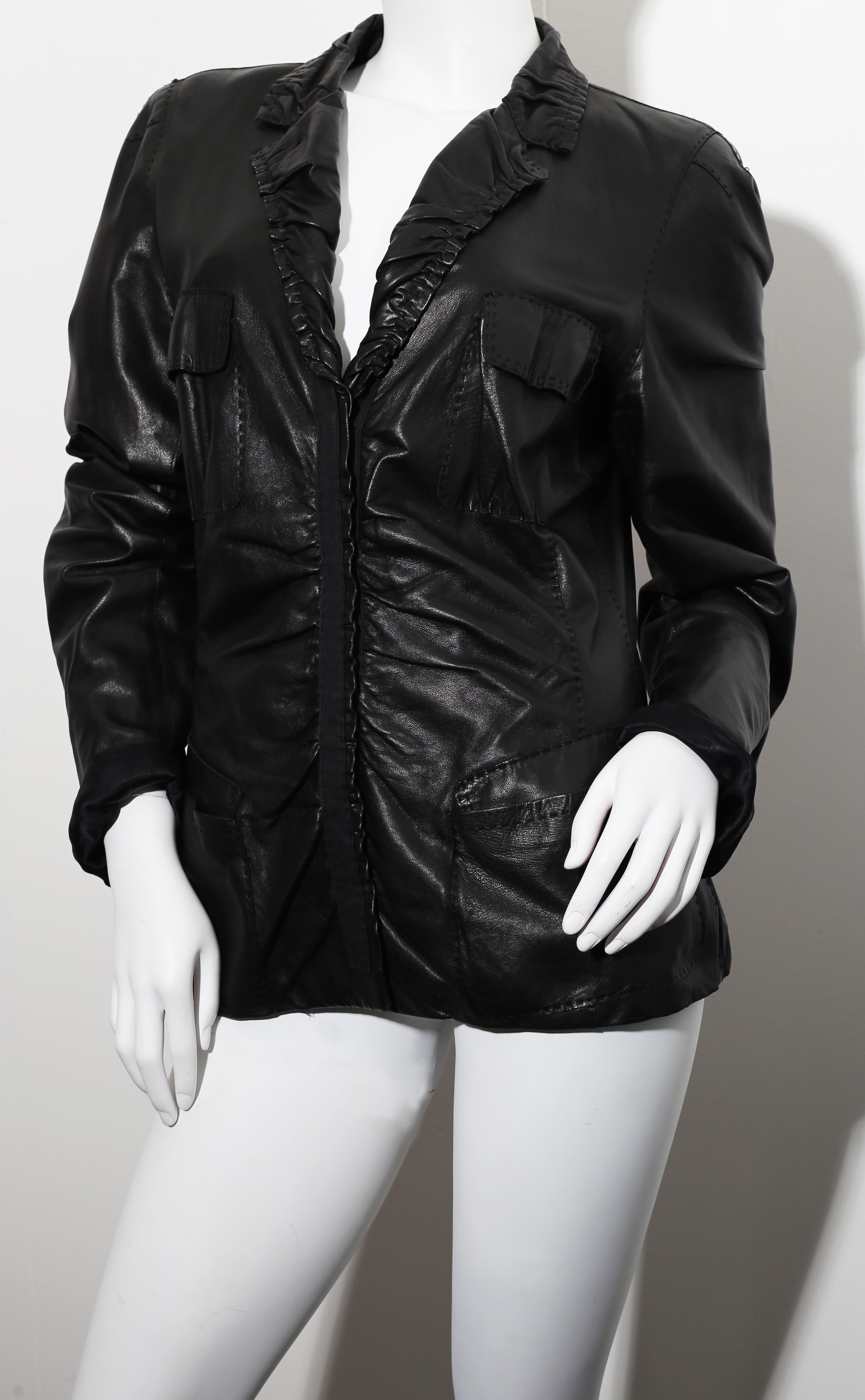 Chic vintage 1990s / 90s DONNA KARAN Black Label Lambskin black leather vest! 
Incredibly flattering tailored piece by this iconic designer. 
Features clip buttons up the bodice.
Luxurious soft Lambskin leather of the highest quality! 
Fully lined.