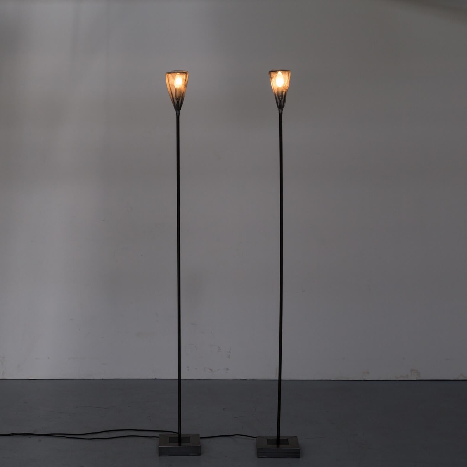 One set of two original 1990s edition metal floor lamps for Baxter Italy. Good and working condition consistent with age and use.