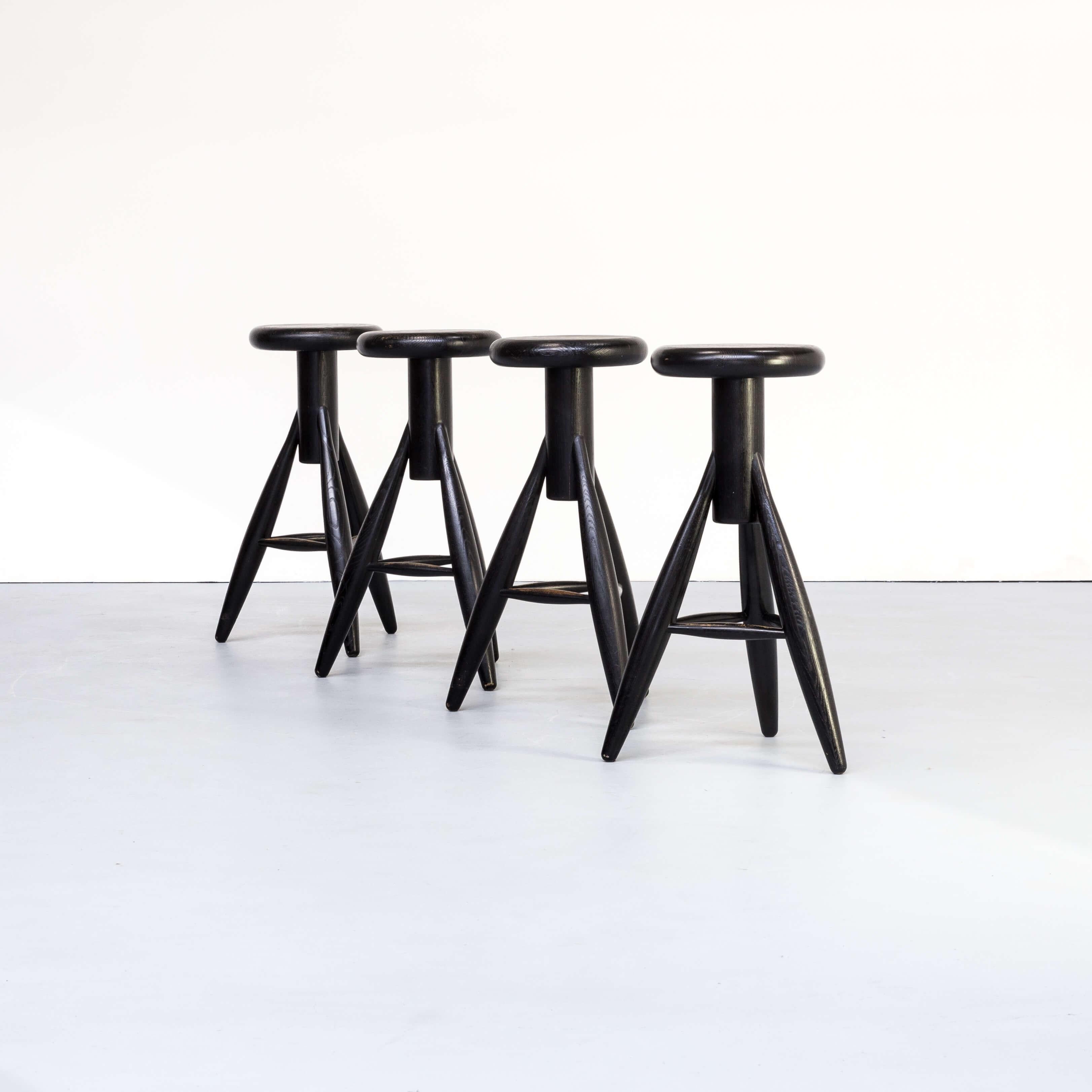 1990s Eero Aarnio ‘EA001’ black stool for Artek set/4. This set of four amazingly shaped black wooden stools is called EA001. He designed the EA001 primarily for his home kitchen bar. Full wooden quality, timeless object. Good condition consistent
