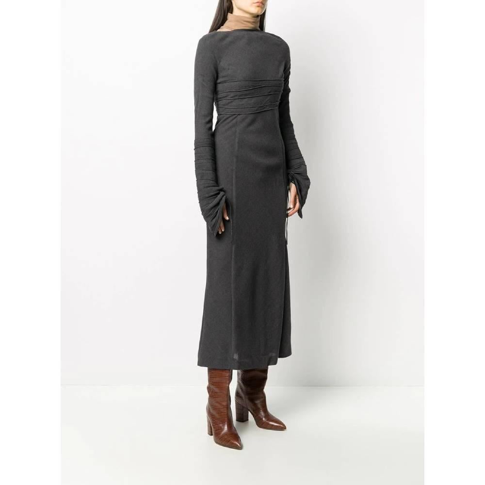 Gianfranco Ferré gray wool blend dress. Round neckline, decorative draped front, drawstring on the sleeves and side zip closure.

Size: 38 IT

Flat measurements:
Height: 139 cm
Bust: 40 cm
Shoulders: 41 cm
Sleeves: 79 cm

Product code: