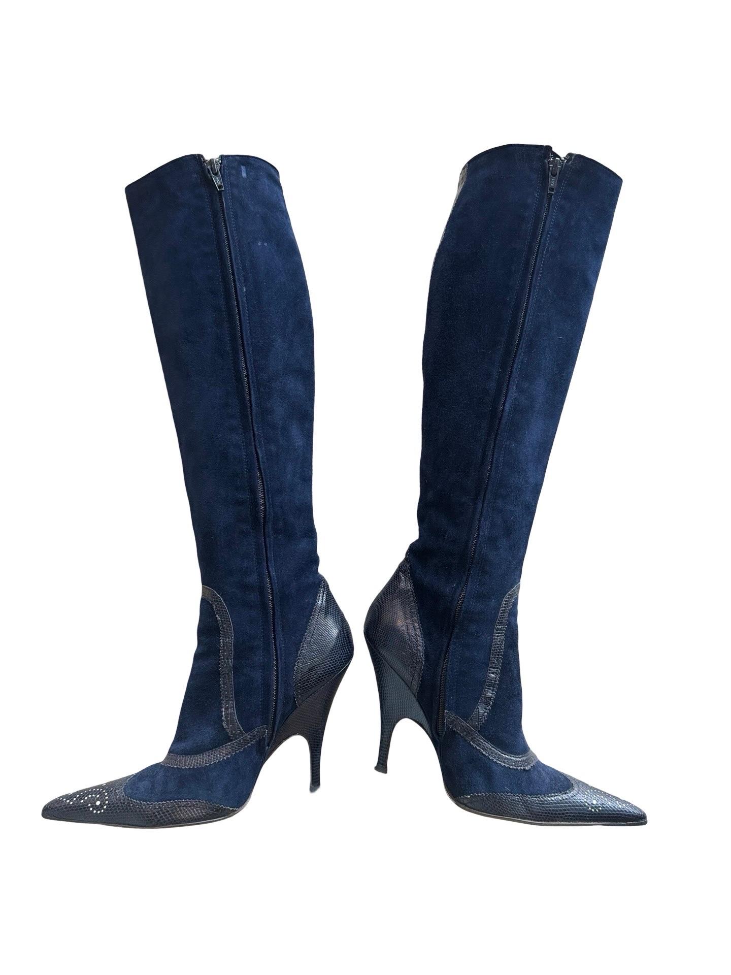 Gorgeous! Navy suede knee high boots with contrasting navy leather detailing around the heel and toe giving off a sort of Edwardian vibe.  There is laser cut out design on the toe that shows a white leather behind.

4