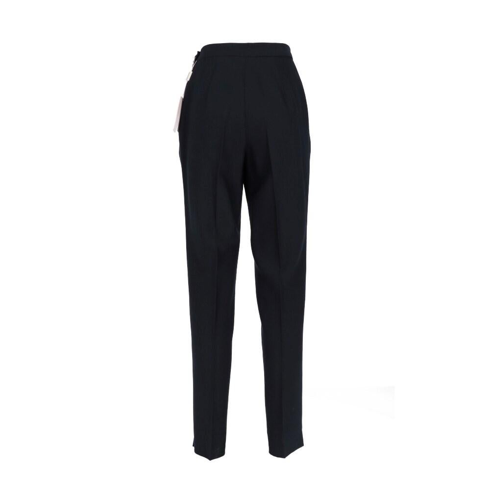 Gianfranco Ferré Studio blue wool crepe trousers. Side zip and button closure, front pleat, side welt pockets and small slit on the bottom.

Flat measurements size: 40 IT
Height: 102 cm
Waist: 34 cm
Internal leg: 74 cm

Product code: X1123

Notes: