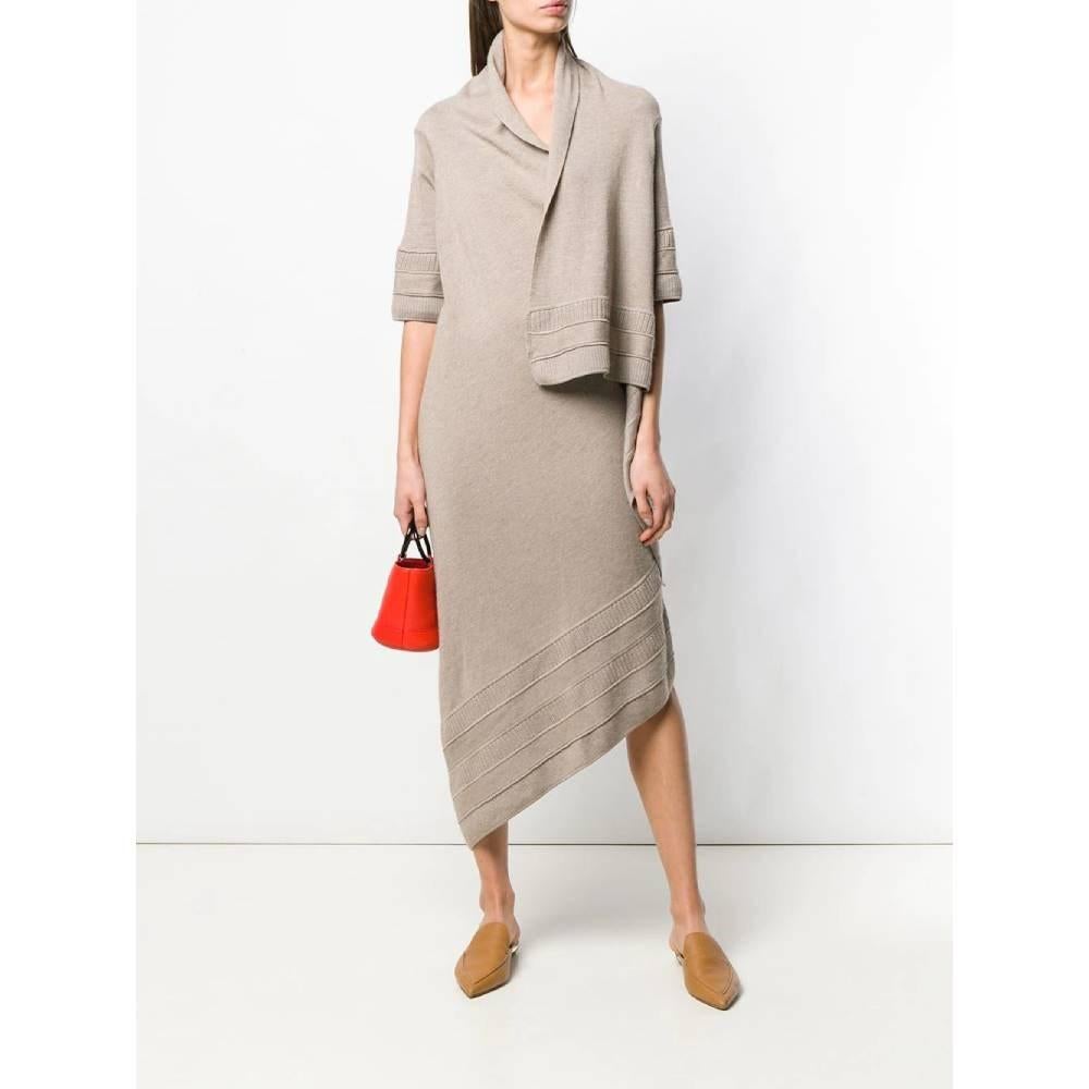 Gianfranco Ferré beige wool knit dress. Wap closure model, short sleeves and asymmetrical skirt.

Size: 46 IT

Flat measurements
Height: 125 cm
Sleeves: 30 cm

Product code: A6029

Composition: 100% Wool

Made in: Italy

Condition: Very good