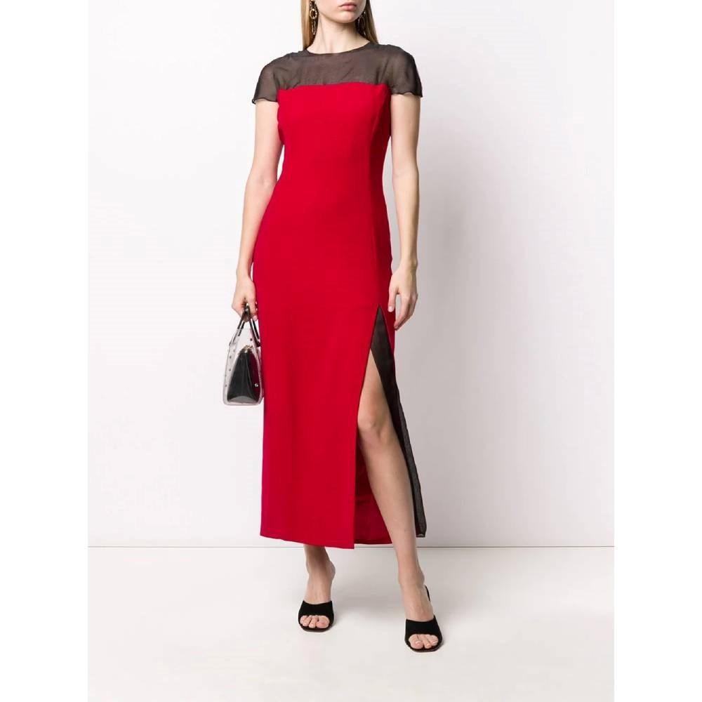 90s Gianfranco Ferré long red wool dress. Black sheer top with round neck and short sleeves. Side slit, rear button and zip fastening.

Size: 40 IT

Flat measurements
Height: 130 cm
Bust: 40 cm
Shoulders: 51 cm

Product code: A7388

Composition: 60%