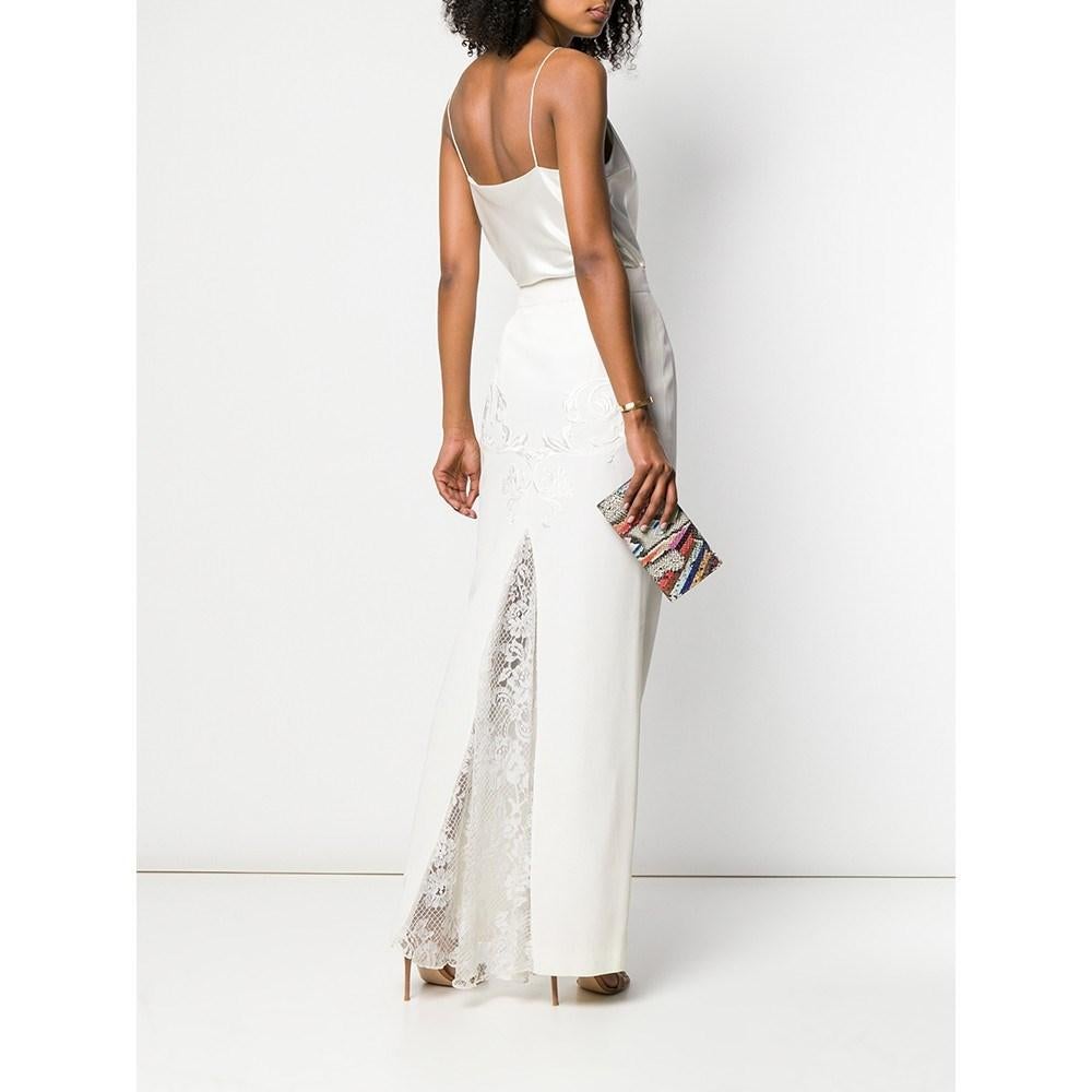 Gianfranco Ferré white mixed fabric long skirt. Straight model with high waist, decorat ive embroidery and slit with lace insert. Side closure with button and zip.

Size 42 IT

Flat measurements
Lenght: 115 cm
Waist: 35 cm
Hips: 46.5 cm

Product