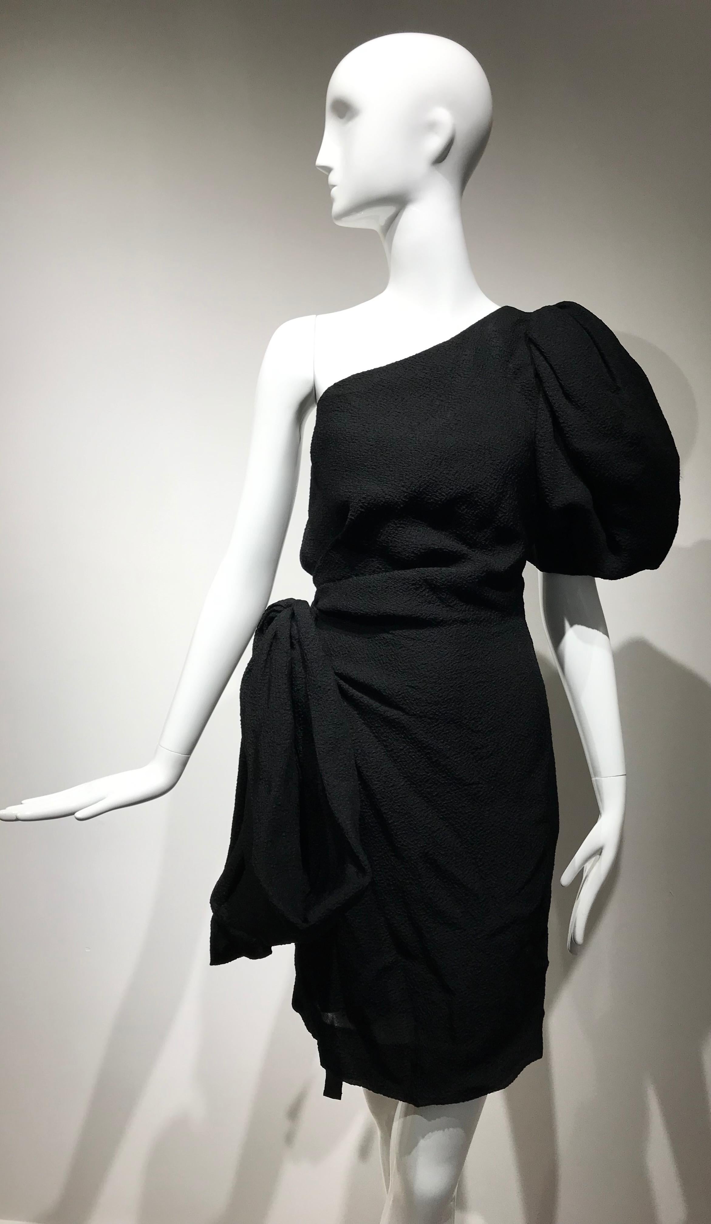 Beautiful Vintage 90s Givenchy designed by Hubert de Givenchy black silk matellasse one shoulder dress with puffy sleeves and bow on the side. 
Size:  small
Bust: 36 inches/ Waist: 28 inches/  hip: 36 inches