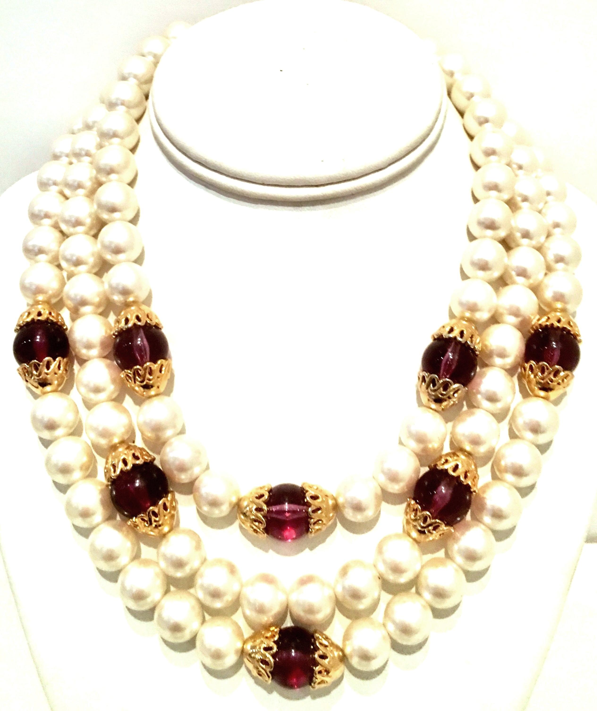 1990'S Faux Pearl, Amethyst Glass Bead & Gold Triple Strand Choker Style Necklace By, Napier. Features white faux pearls, amethyst glass beads and gold plate detail with fold over box style clasp. Each bead is approximately .50
