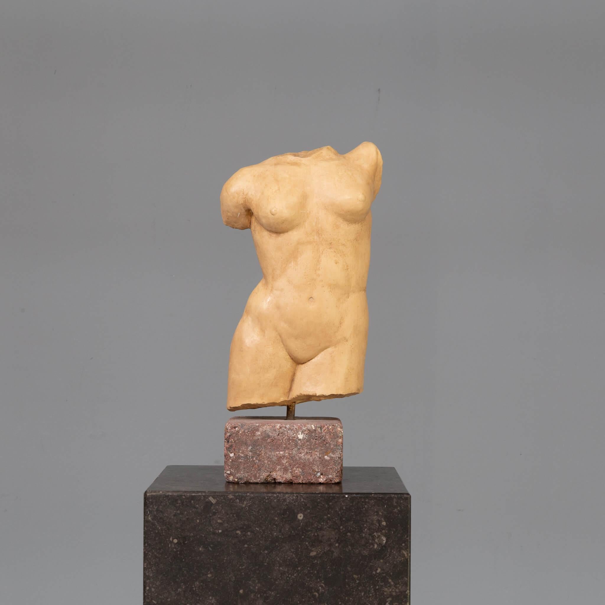 Beautiful stone sculpture of a human body. The sculpture is based on a simple square stone and it has a signature. We are still looking for the artist who is behind the signature. The object fits perfectly in the current time. The body is female but