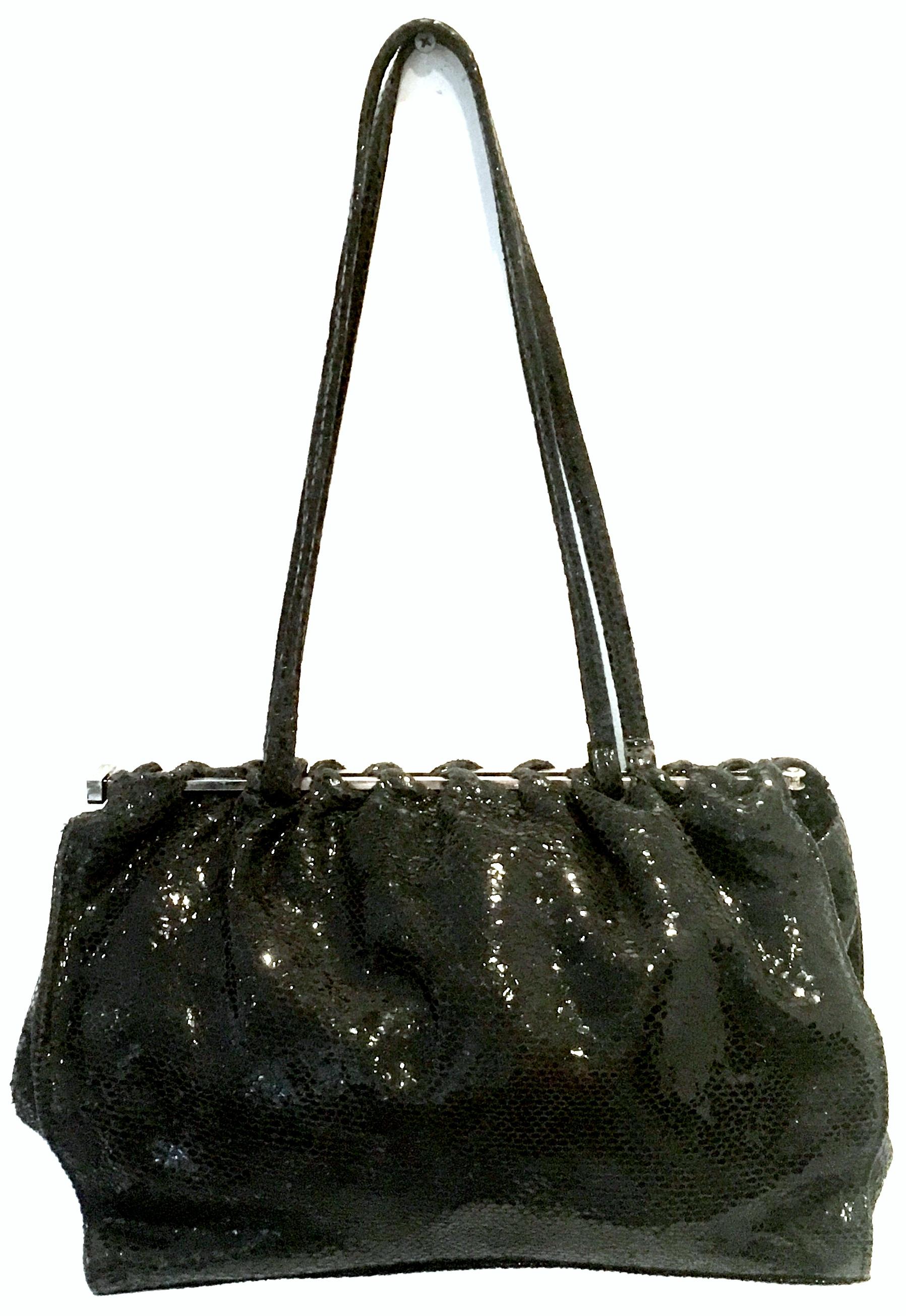 1990'S Italian Jet Black & Chrome Python Hand Bag By, Carla Mancini. This like new soft side python hand bag features jet black python with chrome hardware.Dual purpose, can be used as a clutch style or shoulder style hand bag. Double python